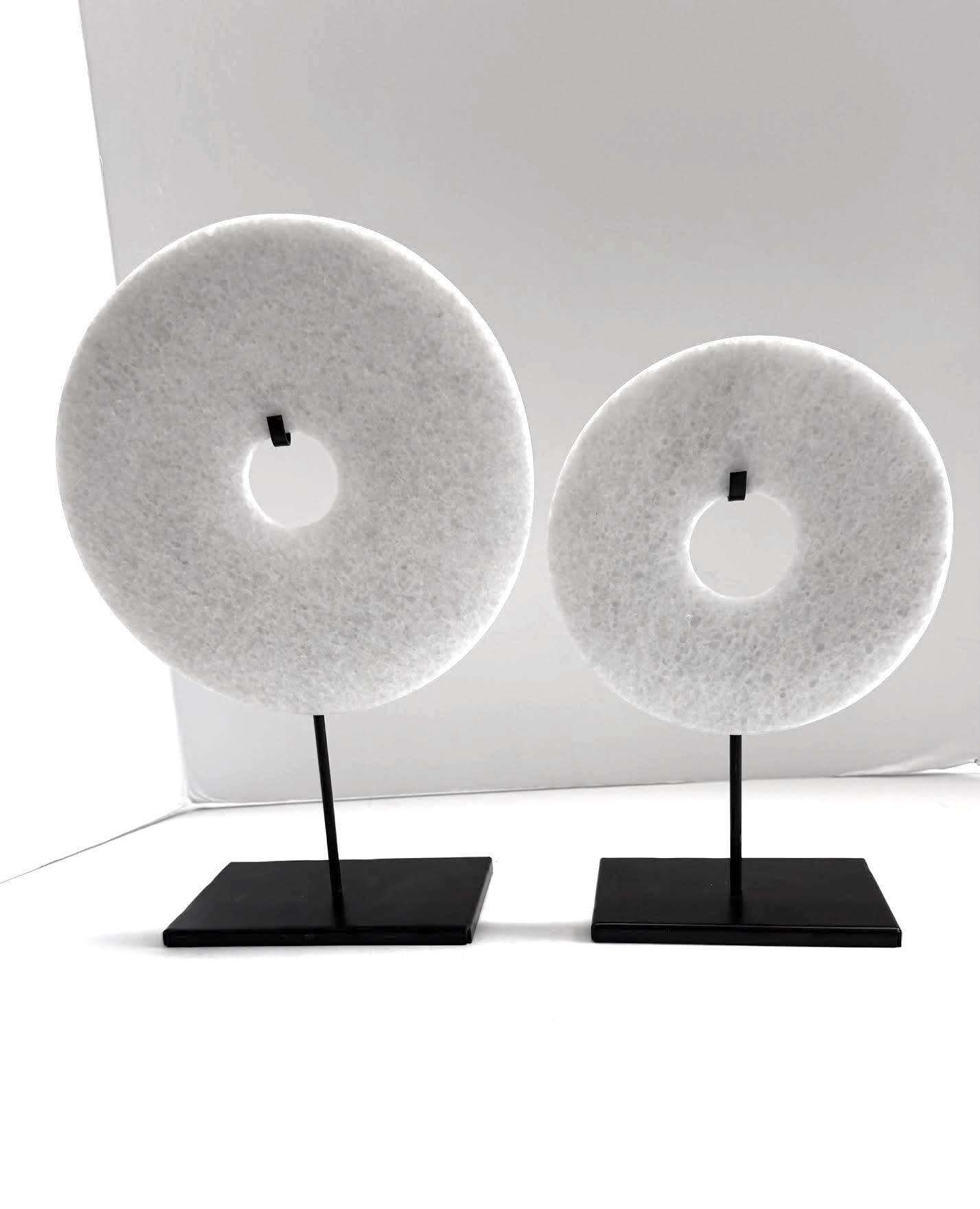 Contemporary Chinese set of two smooth white jade discs on metal stands.
The stone is Dolomite marble stone aka 
