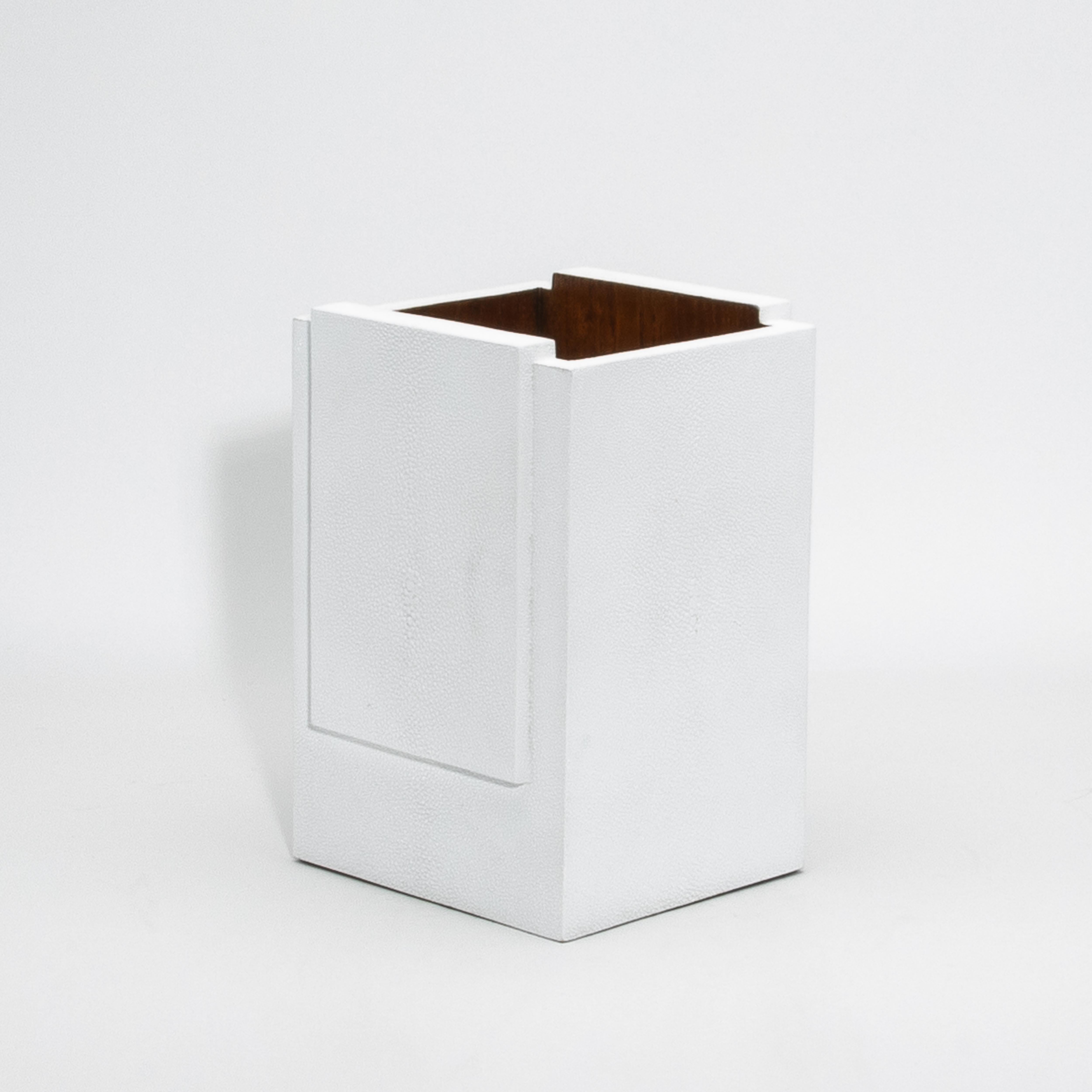 The White Shagreen Waste Bin with Wood Interior by R&Y Augousti is a stunning blend of luxurious craftsmanship and functionality. Its exterior, crafted from hand-selected shagreen, boasts a rich, textured finish that exudes sophistication, while the