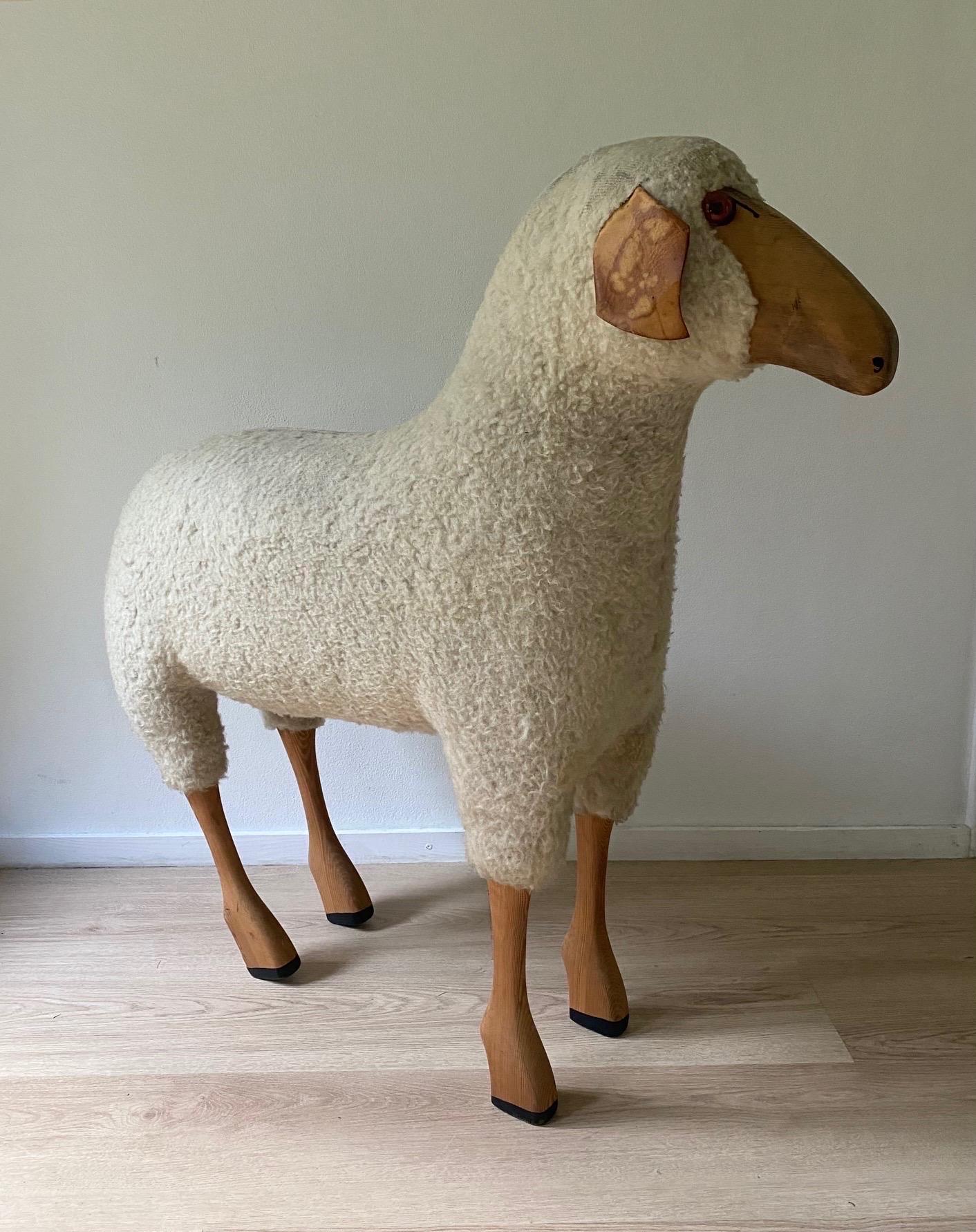Life-size handcrafted white wool sheep by Hans-Peter Krafft, Germany, ca. the 1960s-1970s. The sheep remains in a good/fair vintage condition with the wool thinned out on some area’s. Also some stains on the leather ears. See Images.