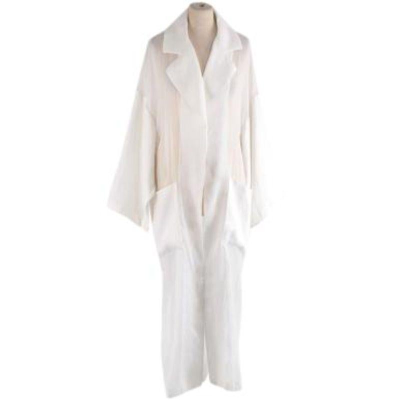 Loewe white sheer cotton voile duster coat
 
 - Semi-sheer, airy cotton voile
 - Notched collar, open front 
 - Tonal self-tie belt 
 - Patch hip pockets 
 - Ankle length
 
 Material: 
 Main: 100% Cotton
 Secondary: 100% Linen 
 
 Made in Italy 
 
