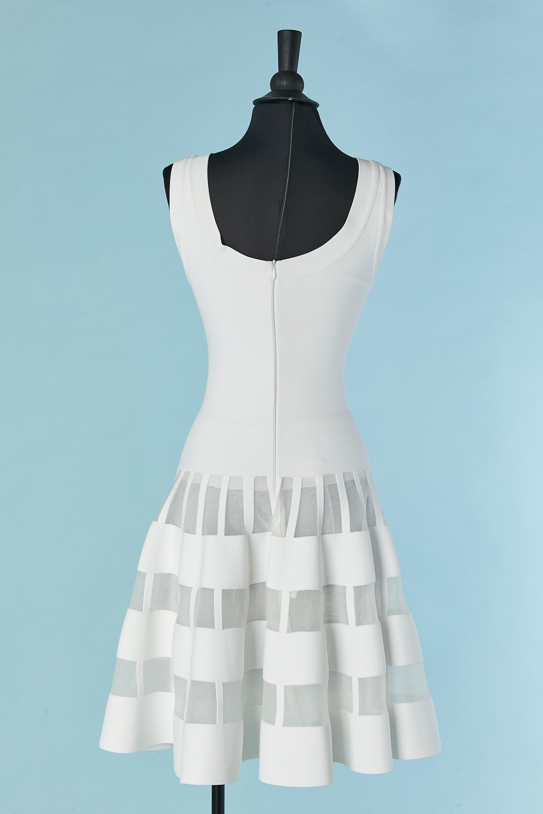 White sleeveless cocktail dress with see-through lines on the skirt AlaÏa 1