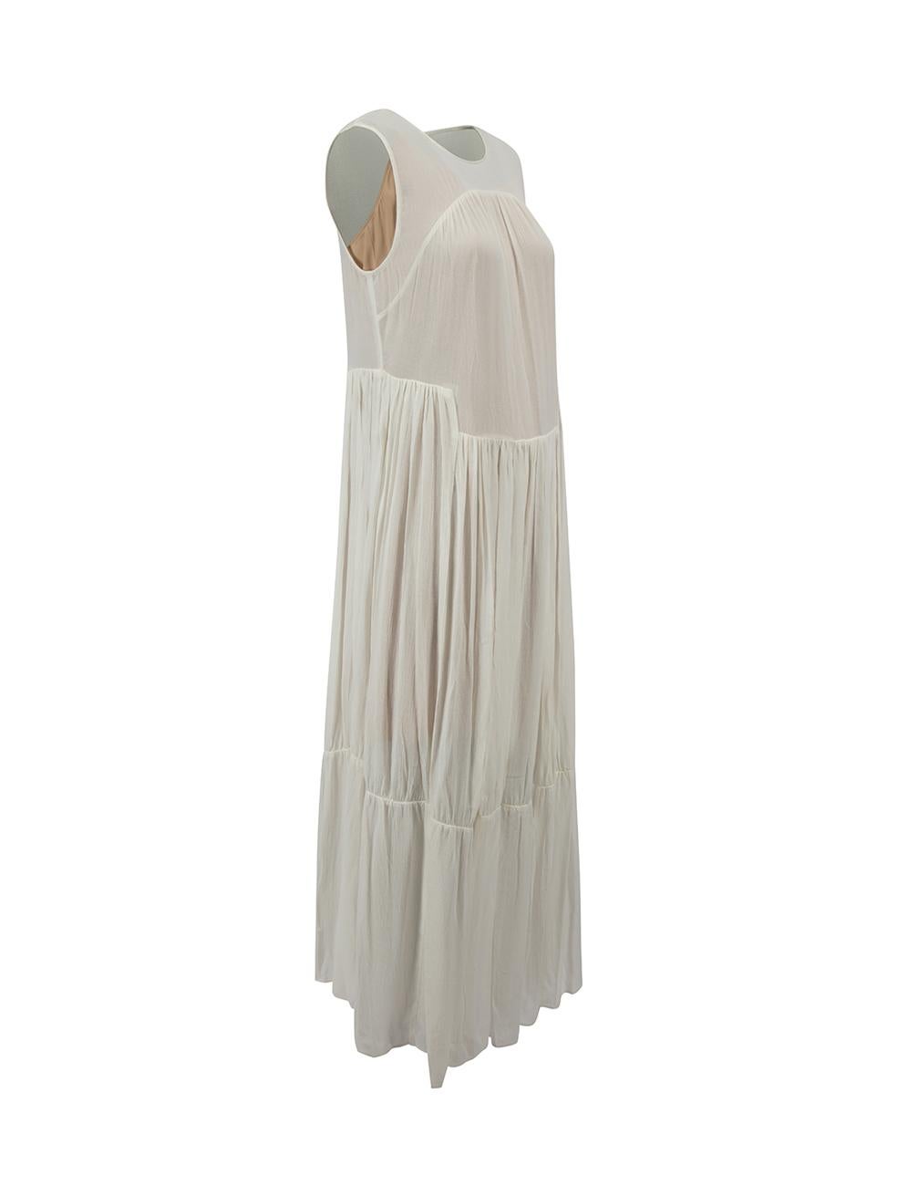 CONDITION is Never Worn, with tags. No visible wear to dress is evident on this used Vince designer resale item.



Details


White

Viscose

Dress

Sleeveless

Round neck

Midi length

Gathered detail

Tiered skirt

Visible beige under dress

Back