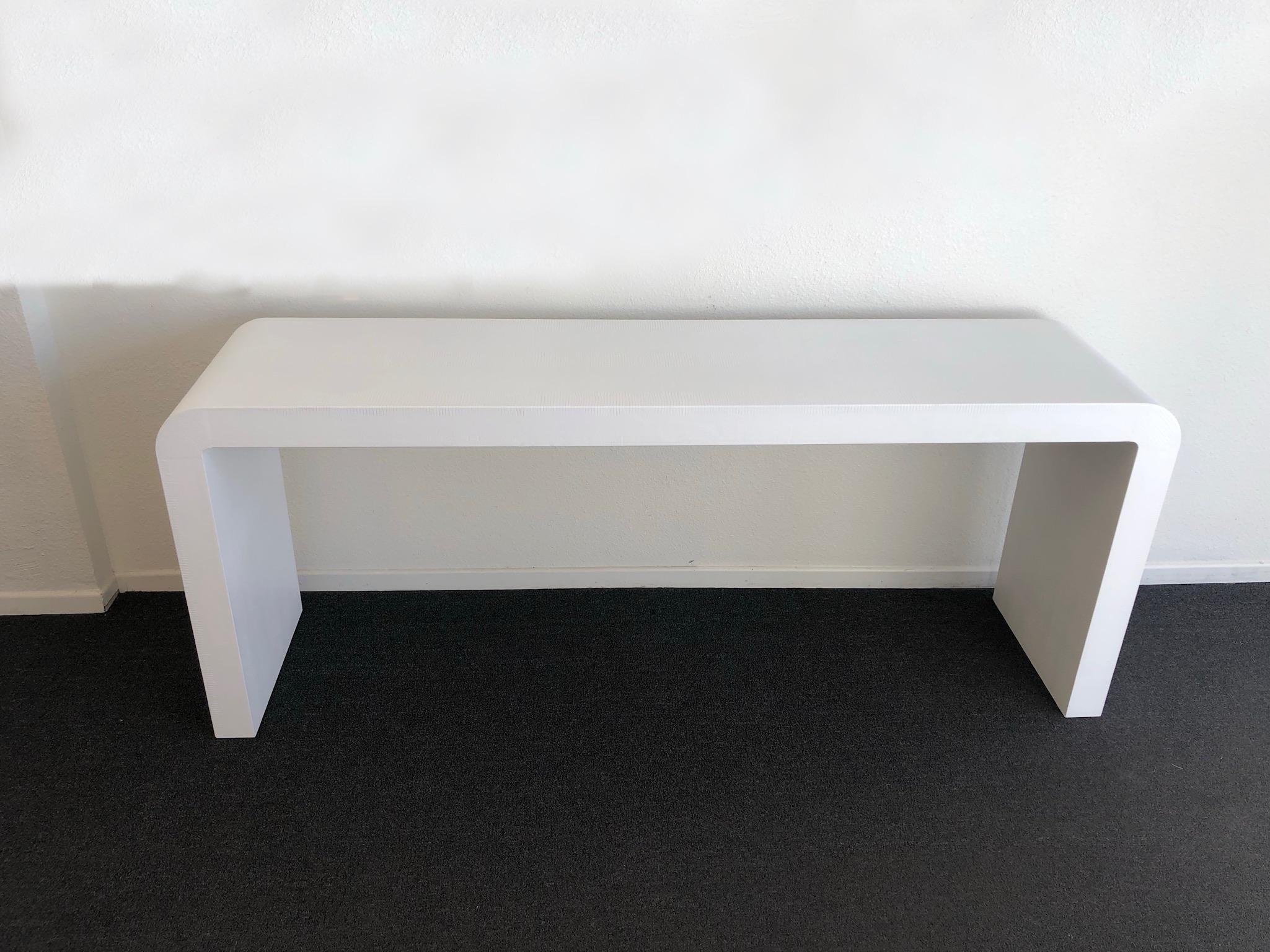 white waterfall console table