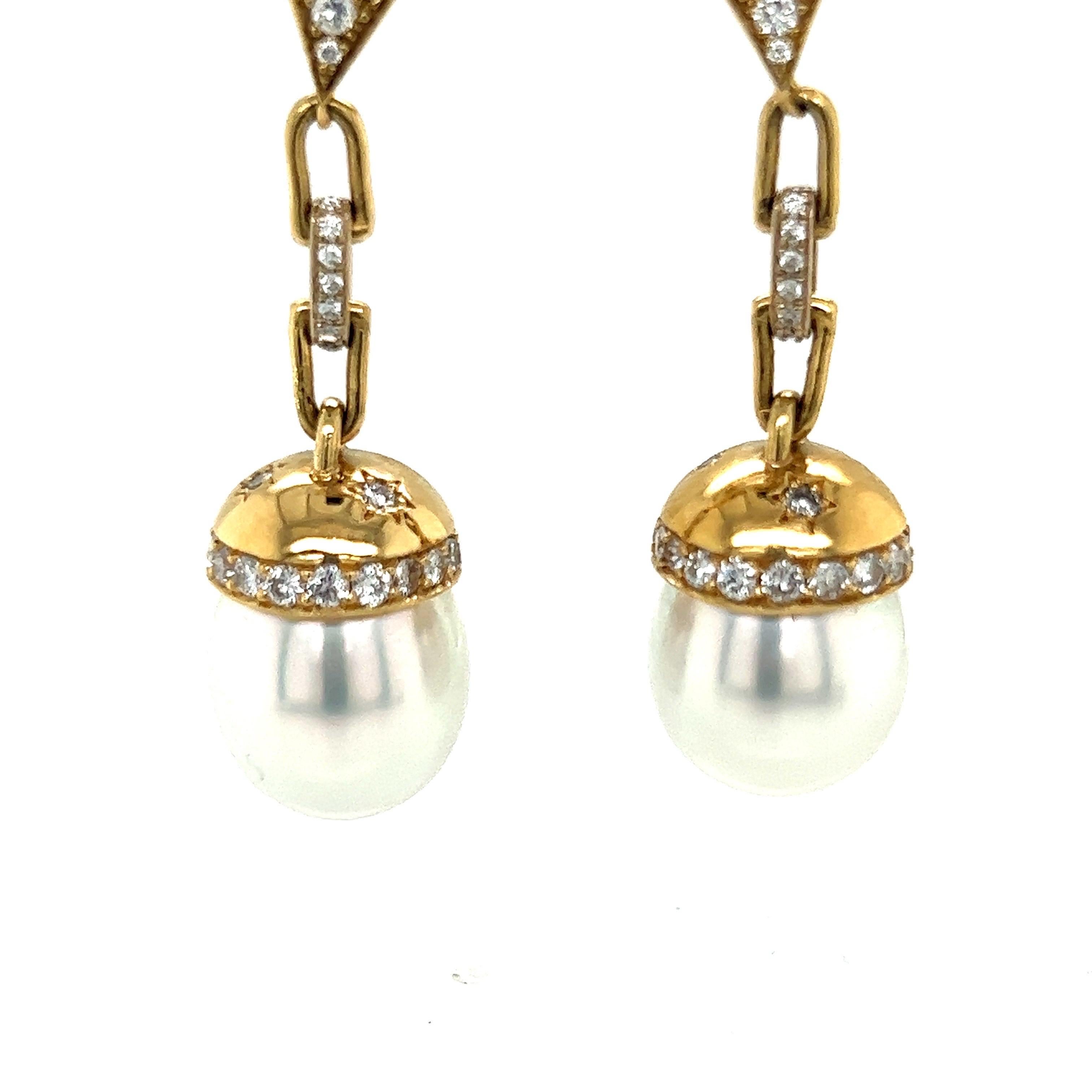 White South Sea drop pearl earrings in 18k
yellow gold with white diamonds

Total diamond weight approx. 1.88ct 
G-H color, VS-2/SI-1 clarity

51-52mm long
