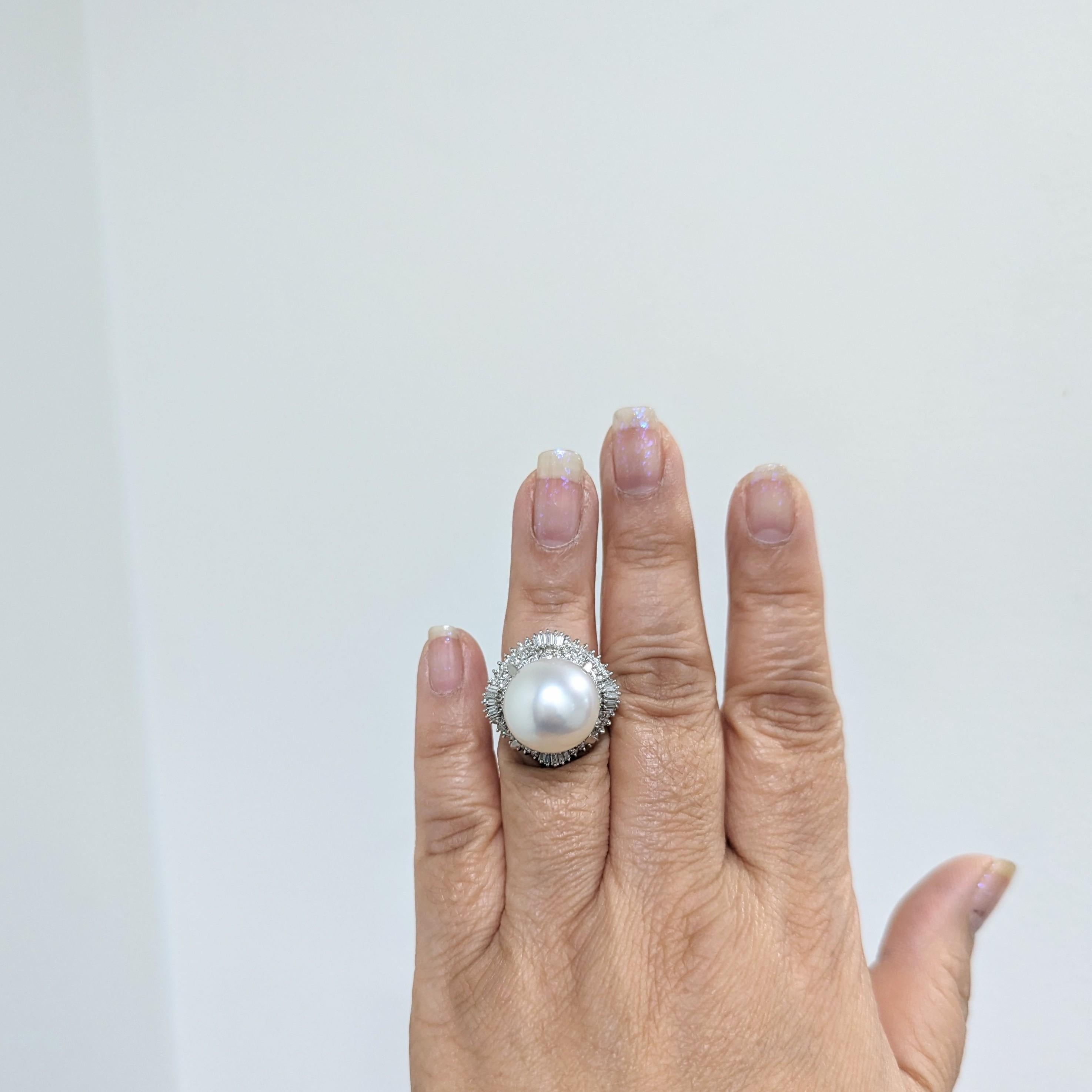 Large 15.4 mm white South Sea white pearl with 1.22 ct. good quality white diamond rounds and baguettes.  Handmade in platinum.  Ring size 6.