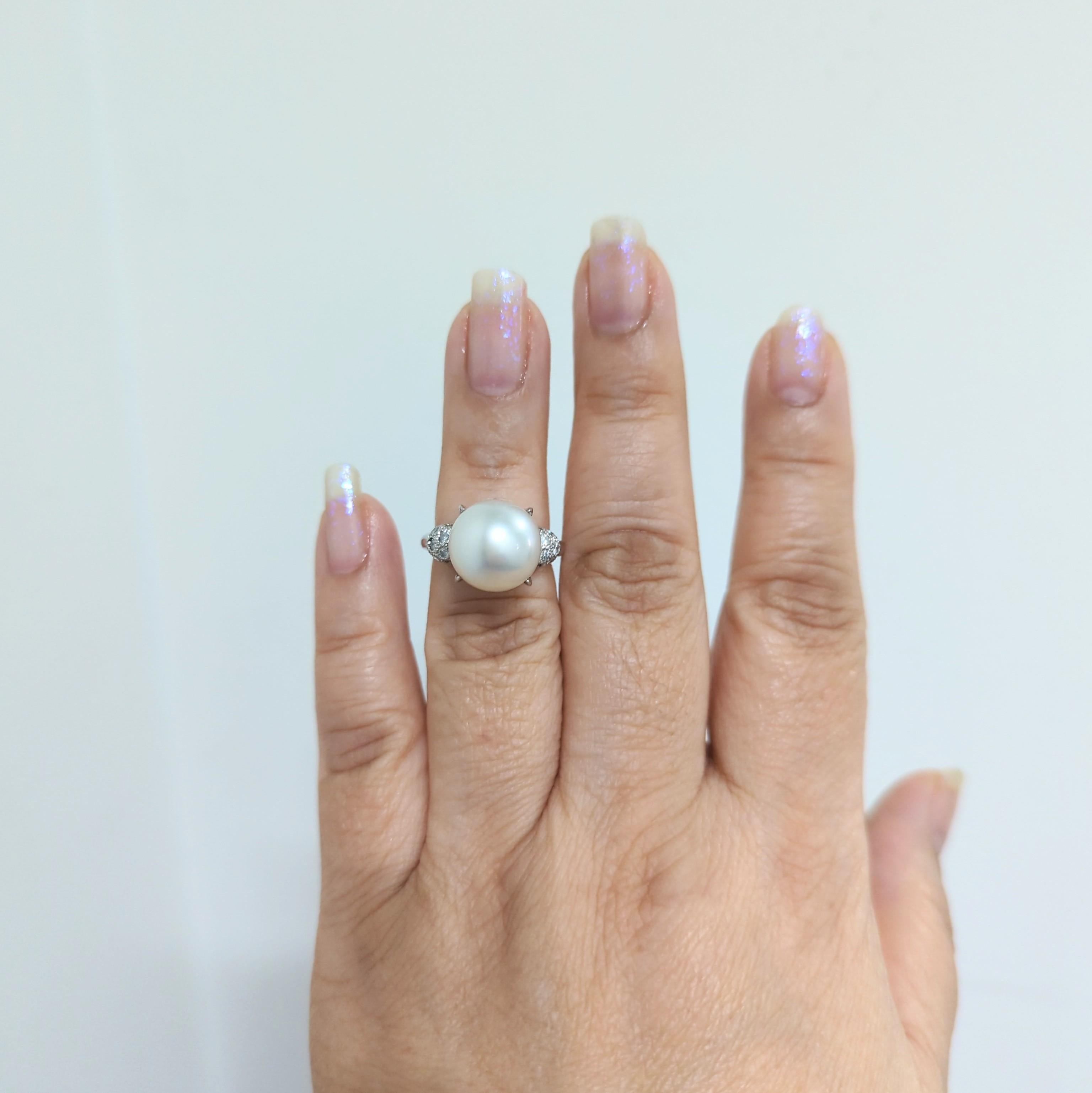 Beautiful 12.5 mm White South Sea round pearl with 0.45 ct. white diamond rounds.  Handmade in platinum.  Ring size 6.