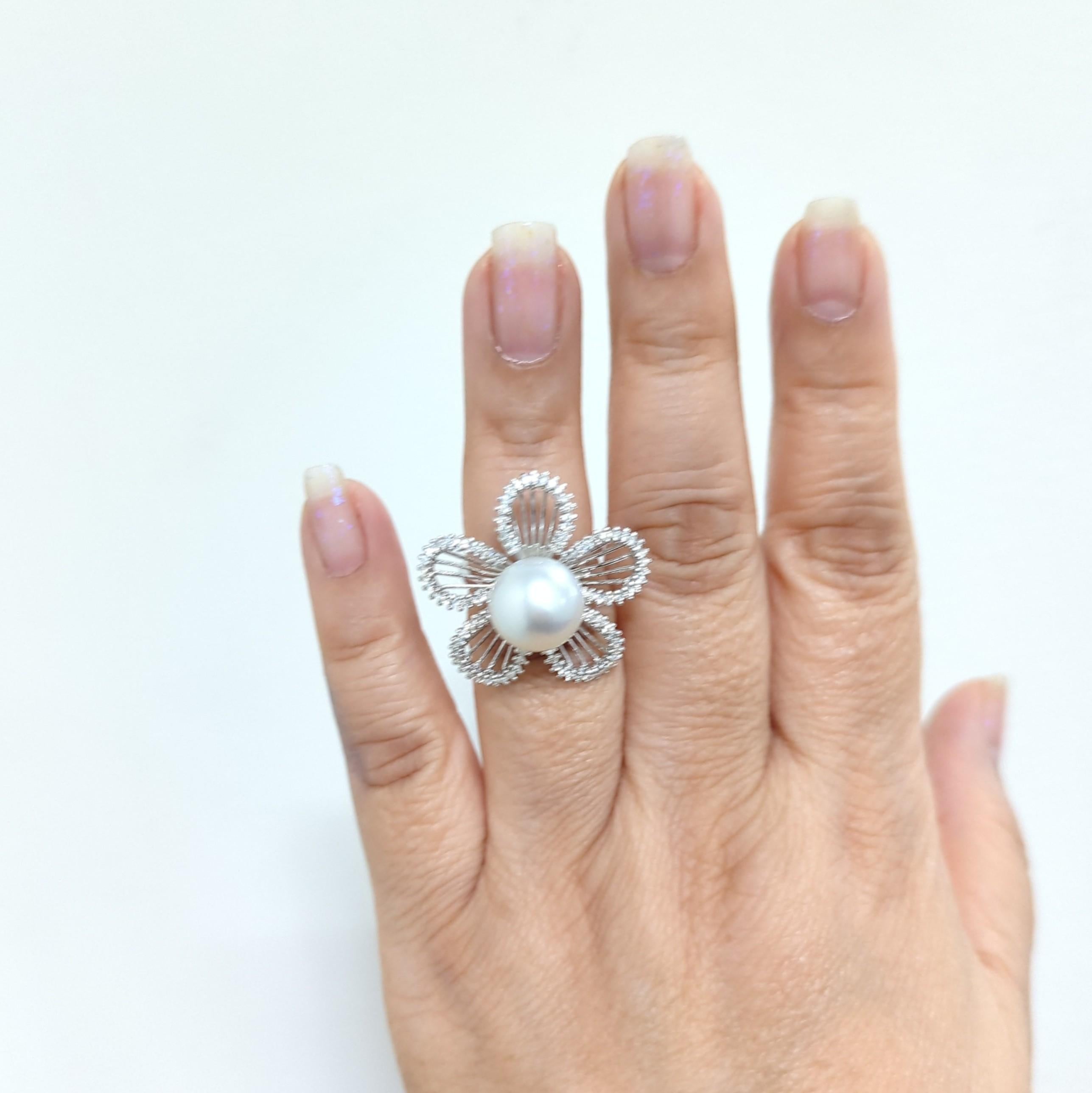 Beautiful cocktail ring with a large white South Sea pearl and good quality white diamond rounds.  Handmade in 18k white gold.  Ring size 6.5.