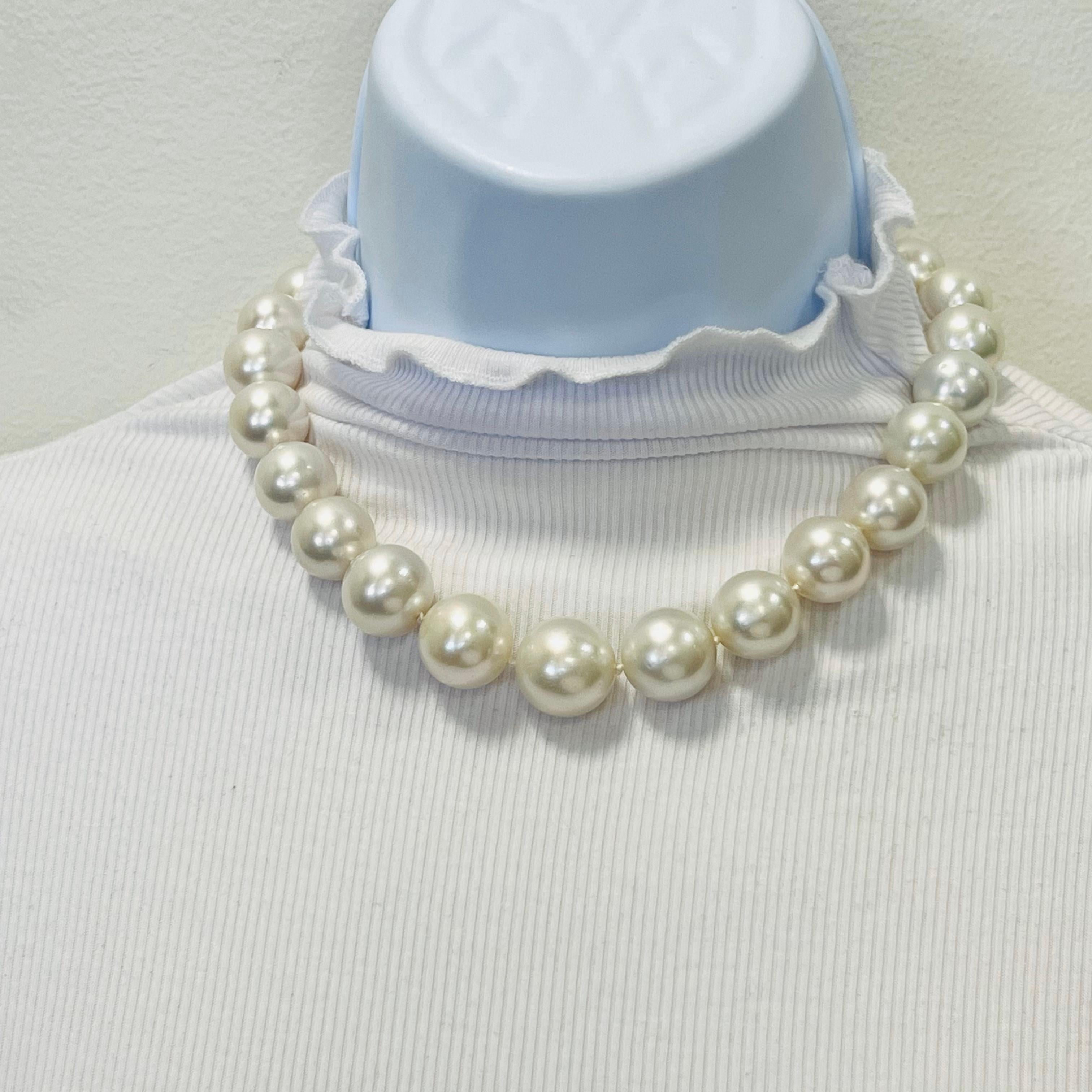 Gorgeous white round South Sea pearls (total of 25) with a ball clasp with 1.75 ct. good quality white diamond pave.  Handmade in 18k white gold clasp and hand strung beautifully.  Length 15.5