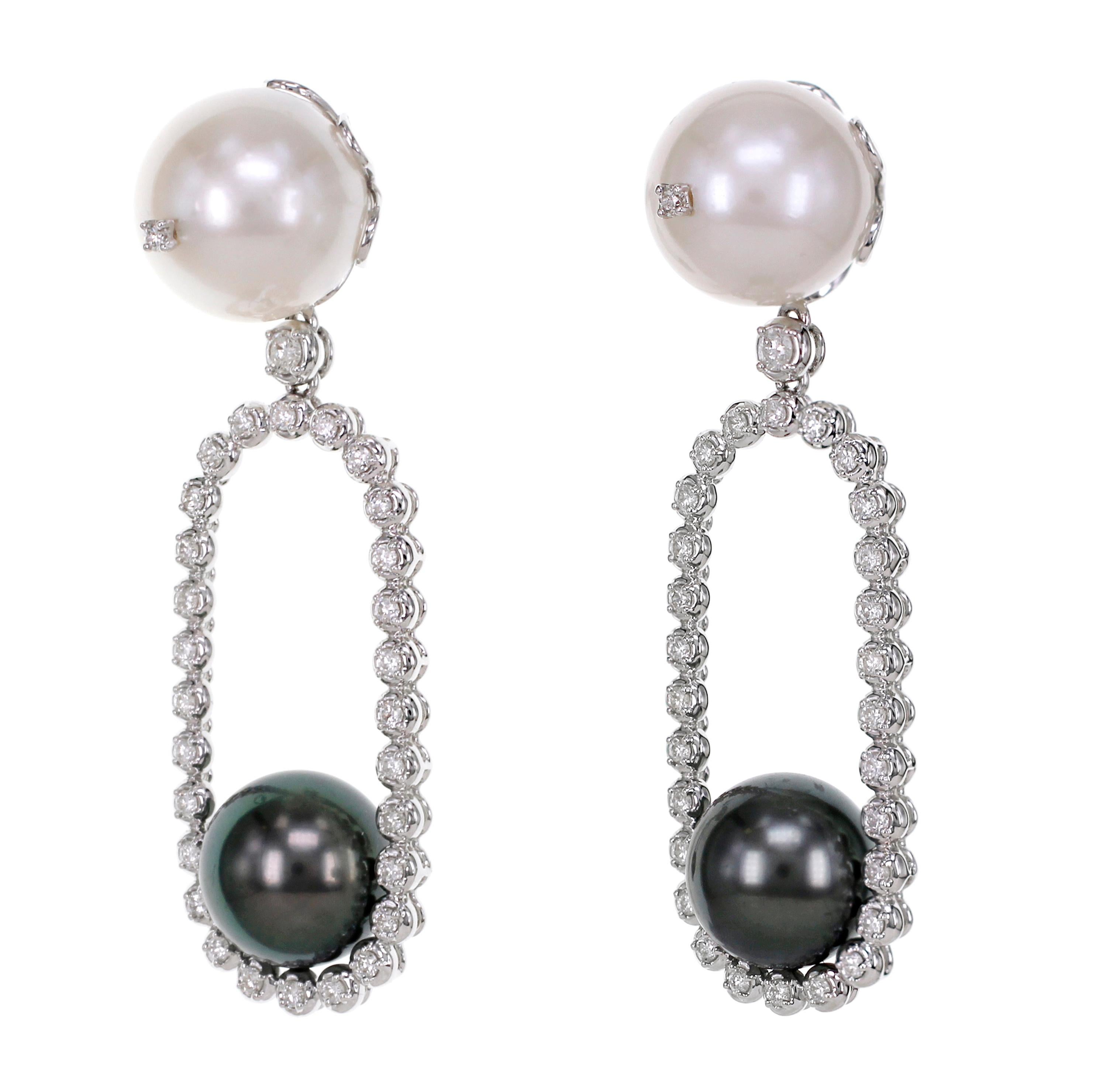 Inspired by Yin and Yang concept, the earring has 18.55 carat of black Tahitian Pearl and 28.30 carat of white South Sea Pearl. On the south sea pearl, we have embedded 2 pieces of white diamond in our trademark ' Stone in Stone ' design.