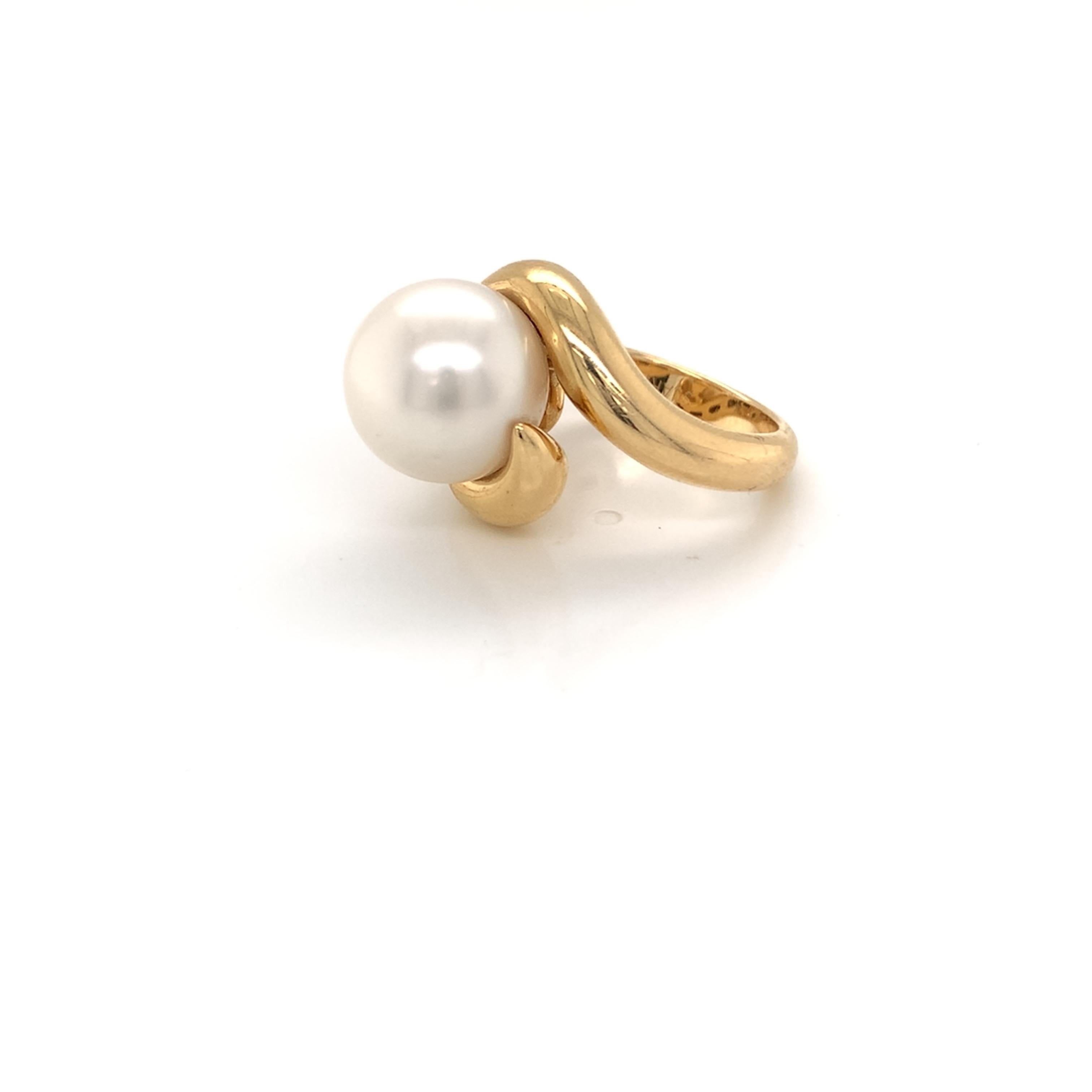 One of a kind natural pearl cocktail ring. Pearl Origin: South Sea Pearl. Color: White, with beautiful luster. Size: 13mm. Mounted on 18kt yellow gold ring size 6.5.