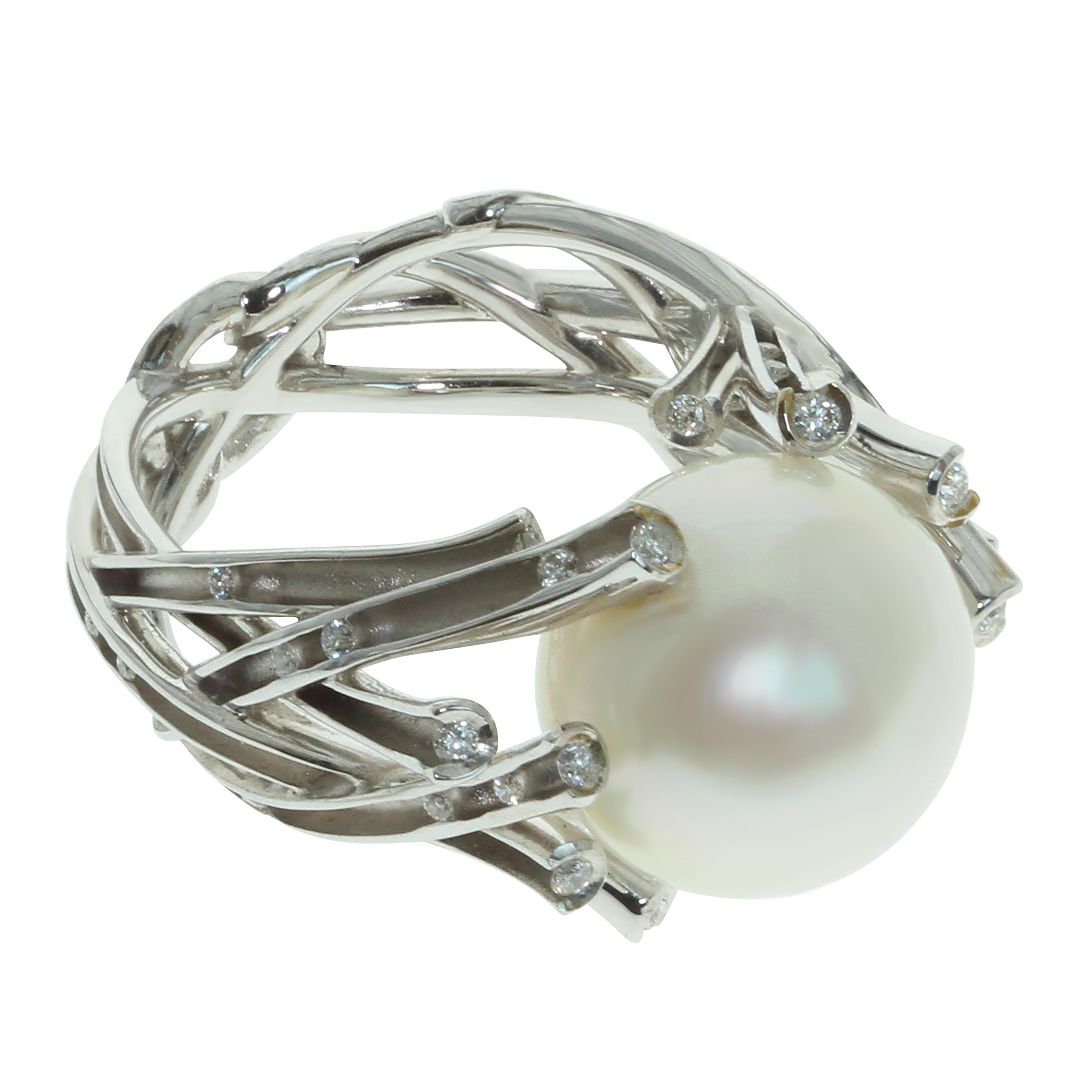 White South Sea Pearl Diamonds 18 Karat White Gold Ring
White 18 Karat Gold is made in the form of frozen brushwood, which glitters in the sun, 40 Diamonds add glitter to it. With its branches, brushwood holds White South Sea Pearl like a snowball.