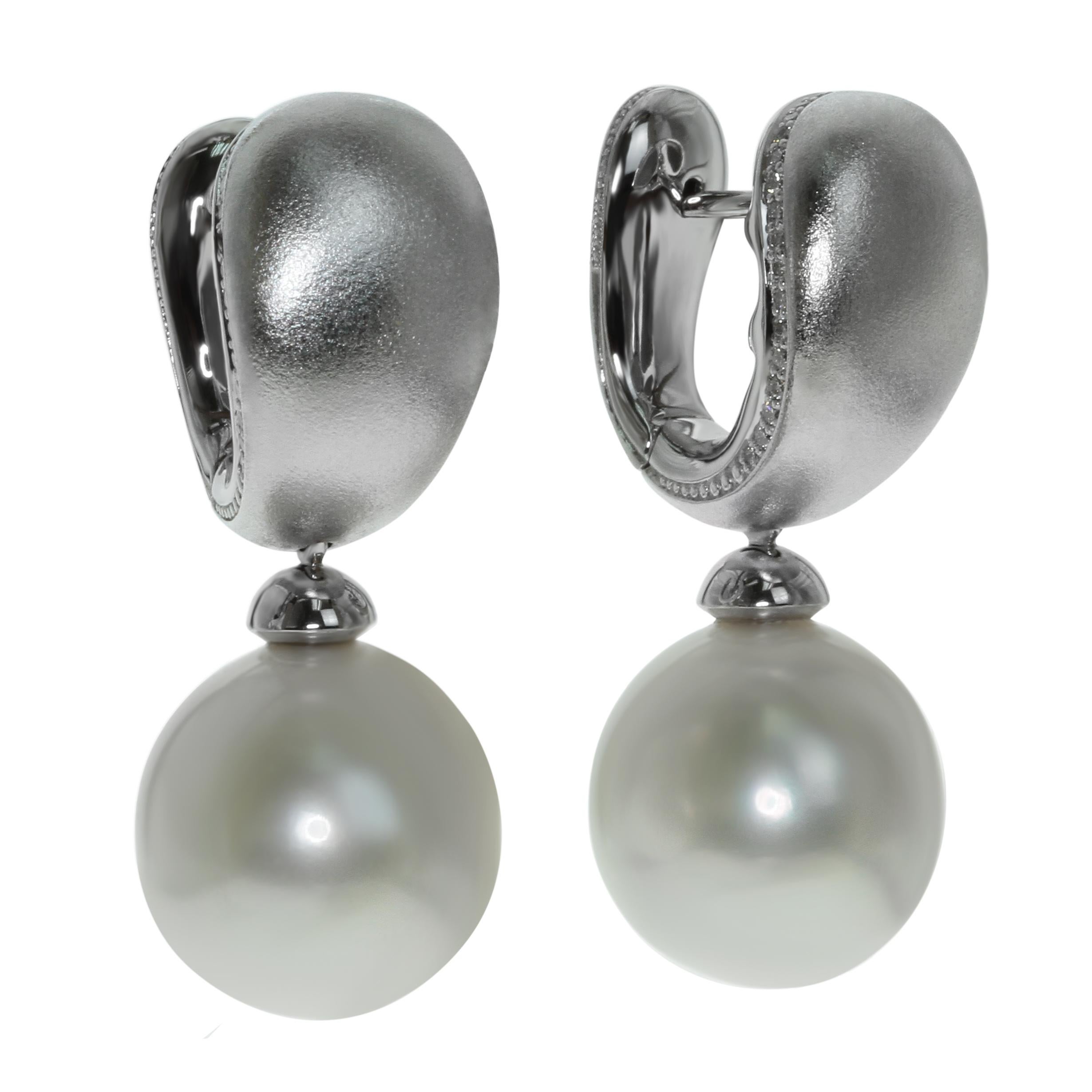 White South Sea Pearl Diamonds Earrings

Very comfortable earrings. Smooth design in combine with a smooth surface of a pearl gives perfect result. Pure white diamonds carefully selected to support the pearl color. Pure triumph of White!!!
Please