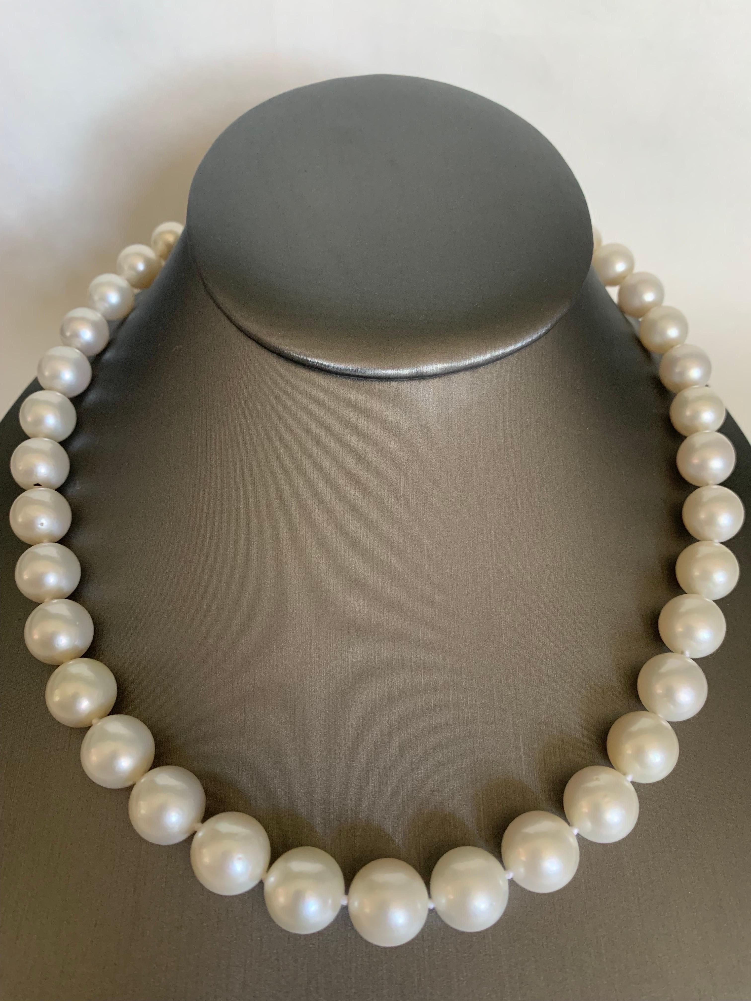 Elevate your look with a timeless graduated pearl necklace. This  17-18 inches long strand necklace is fully knotted and hand strung with matching silk cord. The necklace comprises 39 lustrous white south sea pearls measuring 9-11.8 mm and closure