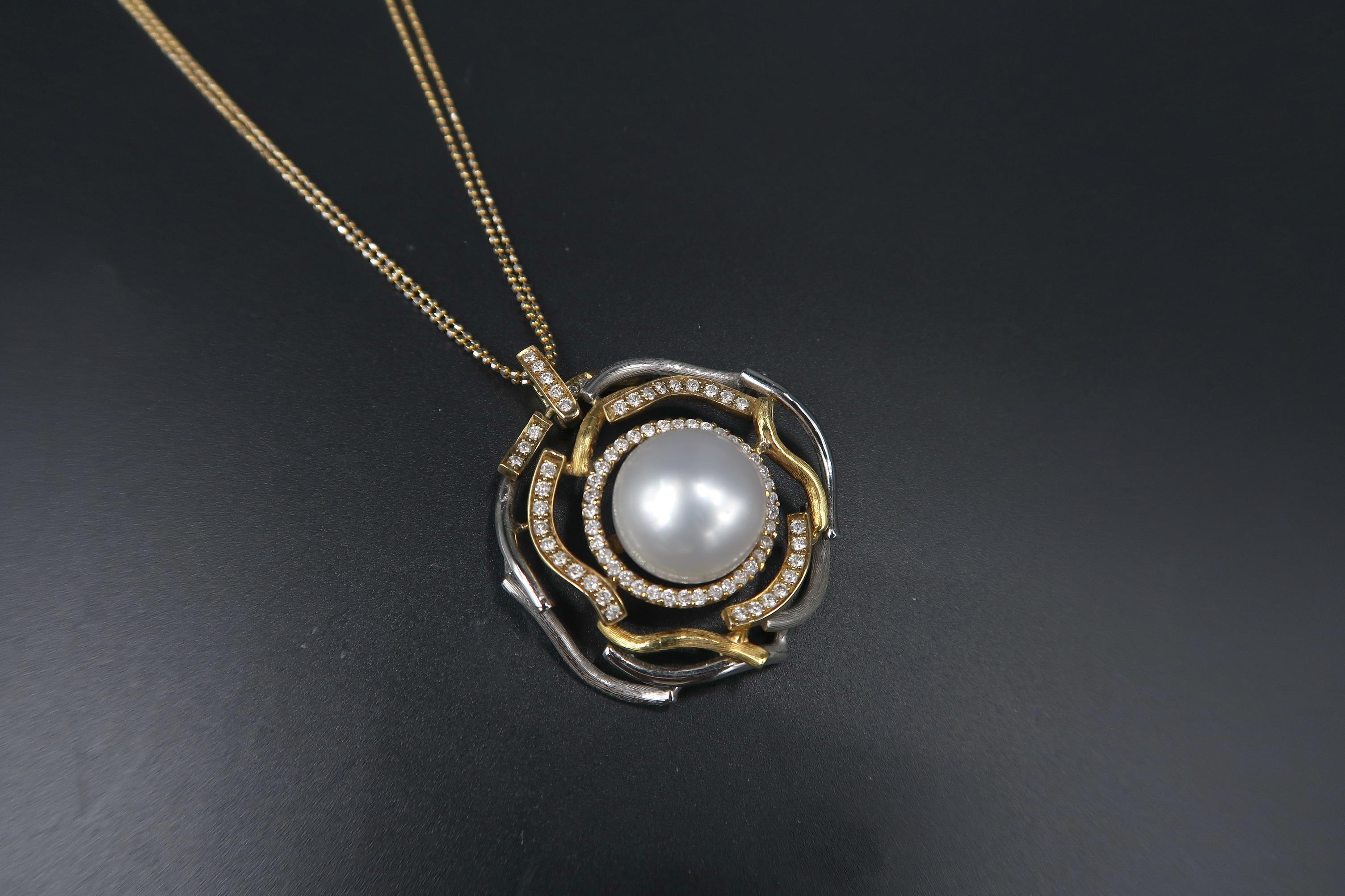 Round-Shaped Wavy Pavé Diamond Halo 2-Coloured Gold Pendant with White South Sea Pearl and Chain in 18K Gold

Pendant
Gold: 18K Gold, 8.982 g
Diamond: 0.81 ct
South Sea Pearl

Chain
Gold: 18K Gold, 4.235 g
Length: 18 inches