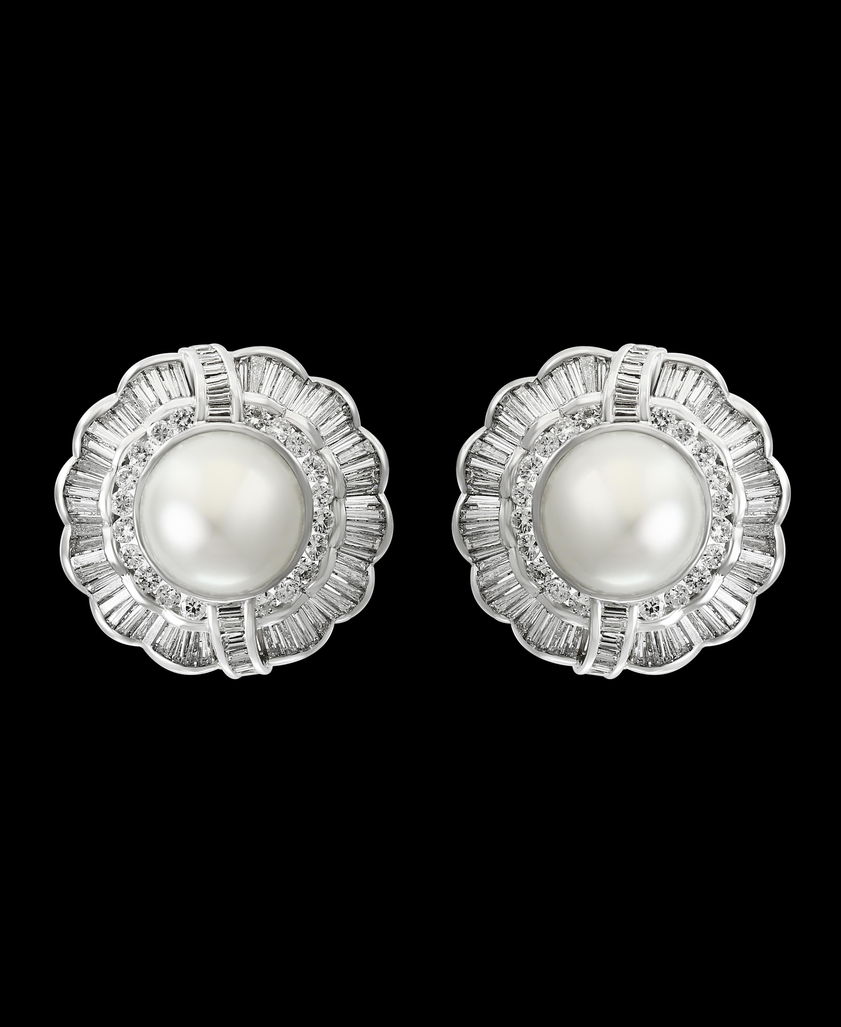 South Sea Pearl with 12 Carat Diamond Cocktail Earrings 18 K Gold
Beautiful estate piece
The Earrings are composed of 2 finest south sea pearl  with no blemishes on it ,  pearls of an incredibly high luster  and significant size 
 14 mm White south