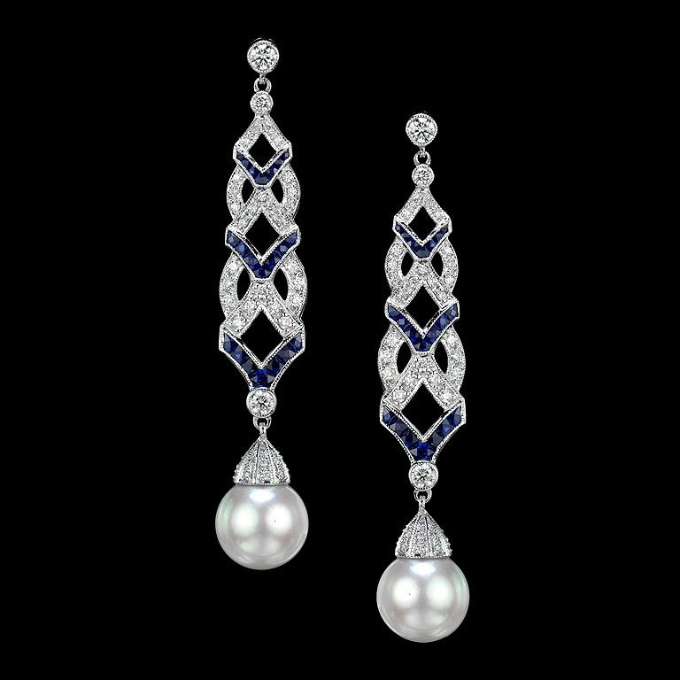 Stand out from the crowd with these lovely Art-Deco-inspired earrings. Each suspending a drop of South Sea Pearl with diamond-set cap, below articulated lines of diamond and sapphire.
Information
Style: Art-deco
Metal: 18K Gold
Width: 10 mm.
Length: