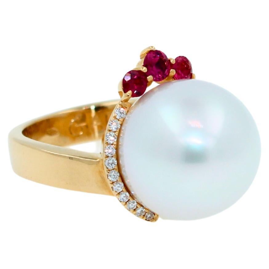 AAA Quality South Sea White Pearl
Beautiful Flying Comet Shape 
Striking Silvery Hue with Light Blue Iridescent  Tones
Very Reflective Surface - Almost Mirror-Like 
16MM Width 17MM Length Size
0.40 cts Diamonds VVS Quality & Reddish Raspberry