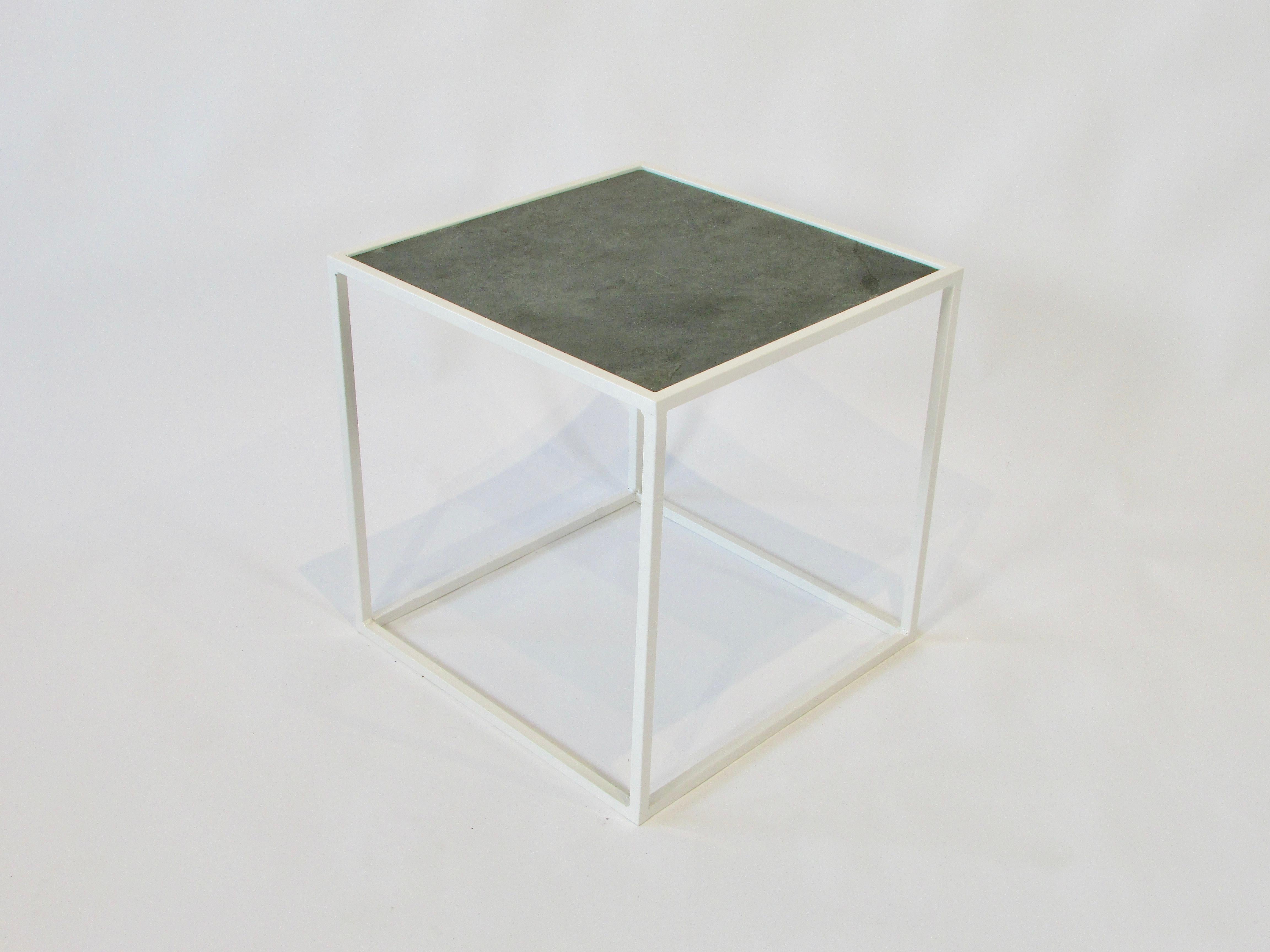 An open cube square-shaped steel frame end table recently powder-coated in white with a cut to fit slate top. Clean modern design with the natural element of slate. c.1960s
Comes with clear glass insert as well.