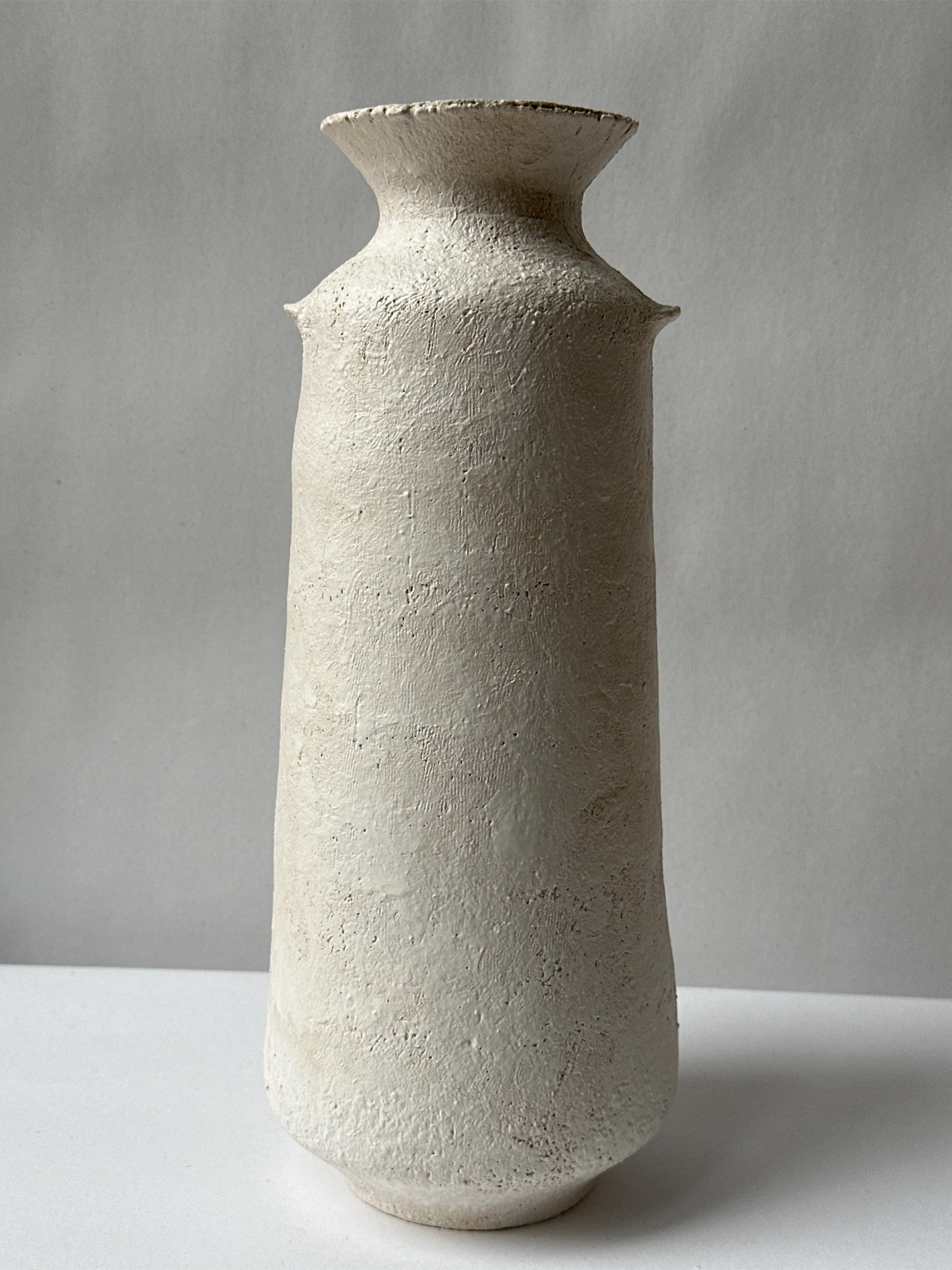 White Stoneware Alavastron Vase by Elena Vasilantonaki
Unique
Dimensions: ⌀ 20 x H 40 cm (Dimensions may vary)
Materials: Stoneware
Available finishes: White, Red, Black, Brown, Black, White Patina

Growing up in Greece I was surrounded by pottery