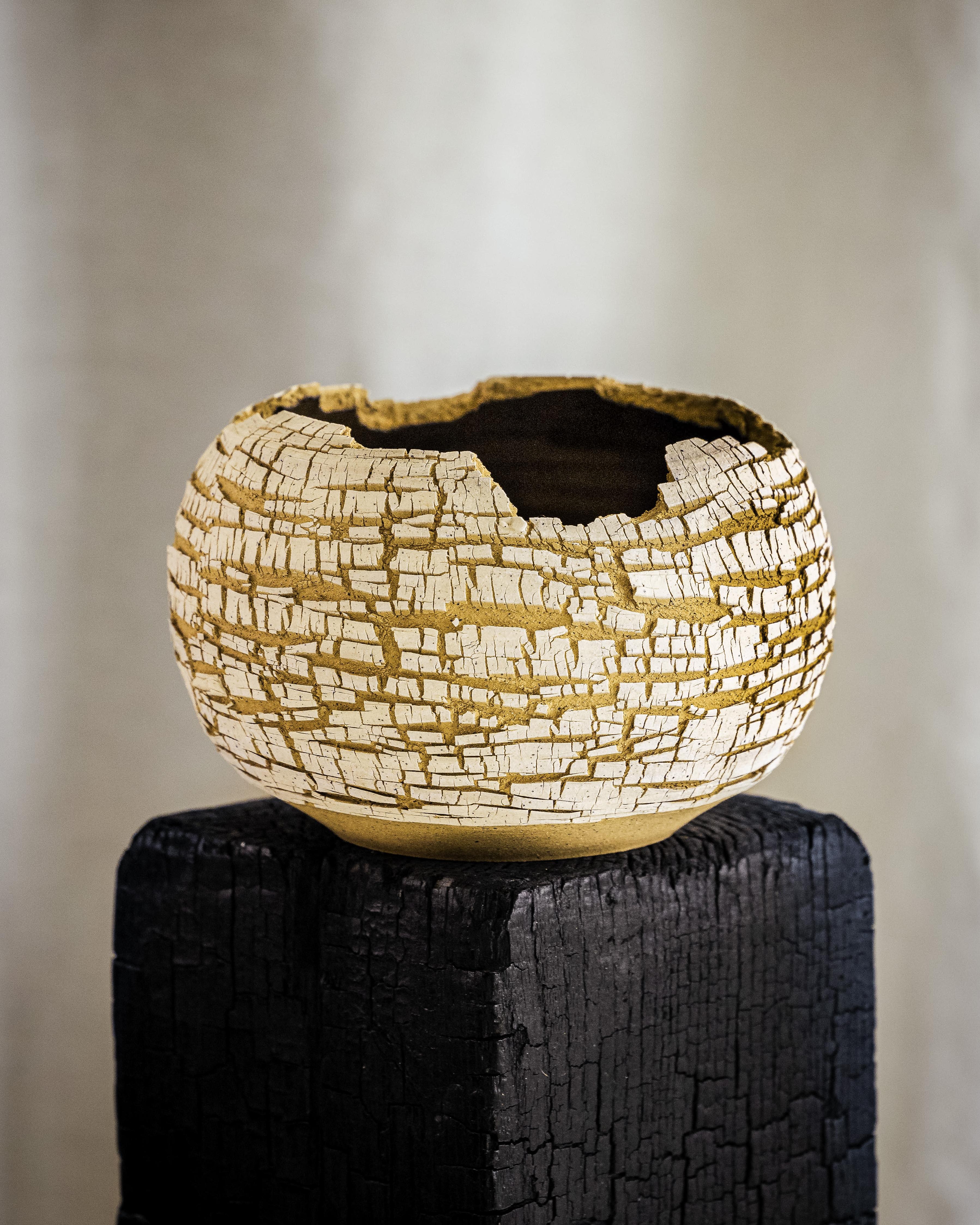 White Stoneware Lined, Distressed Form NO.2  by Alexandria Roby
Dimensions: D 17.78 x H 10.16 cm
Materials: Tan and White Stoneware Lined with Bronze Glaze
Colors - Sandstone/Ivory, or Onyx/Ivory

My first interaction with clay was in 2011 as an