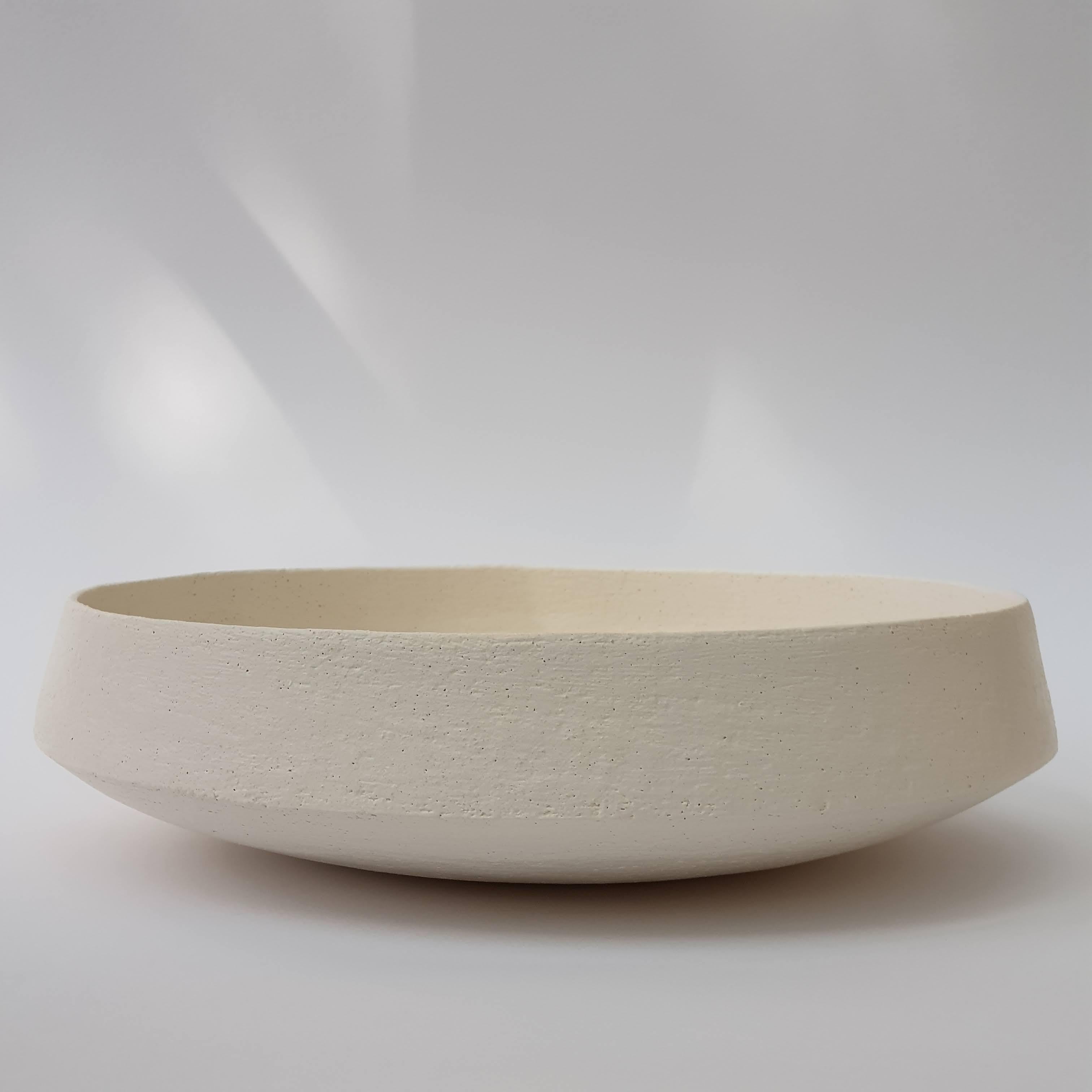 White Stoneware Pinakio Plate by Elena Vasilantonaki
Unique
Dimensions: ⌀ 34 x H 10 cm (Dimensions may vary)
Materials: Stoneware
Available finishes: With\without handles - Black, White, Grey , Brown, Red, White Patina

Growing up in Greece I was