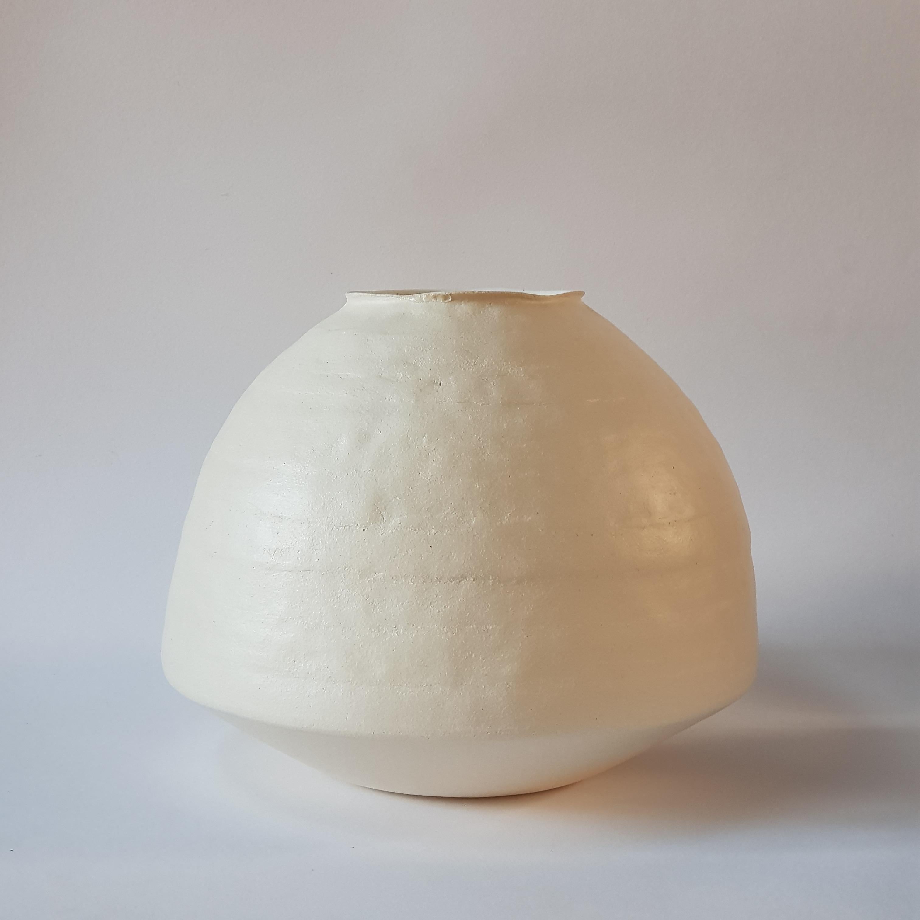 White Stoneware Psykter Vase by Elena Vasilantonaki
Unique
Dimensions: ⌀ 30 x H 25 cm (Dimensions may vary)
Materials: Stoneware
Available finishes: Black, White, Brown, Red, White Patina

Growing up in Greece I was surrounded by pottery forms that