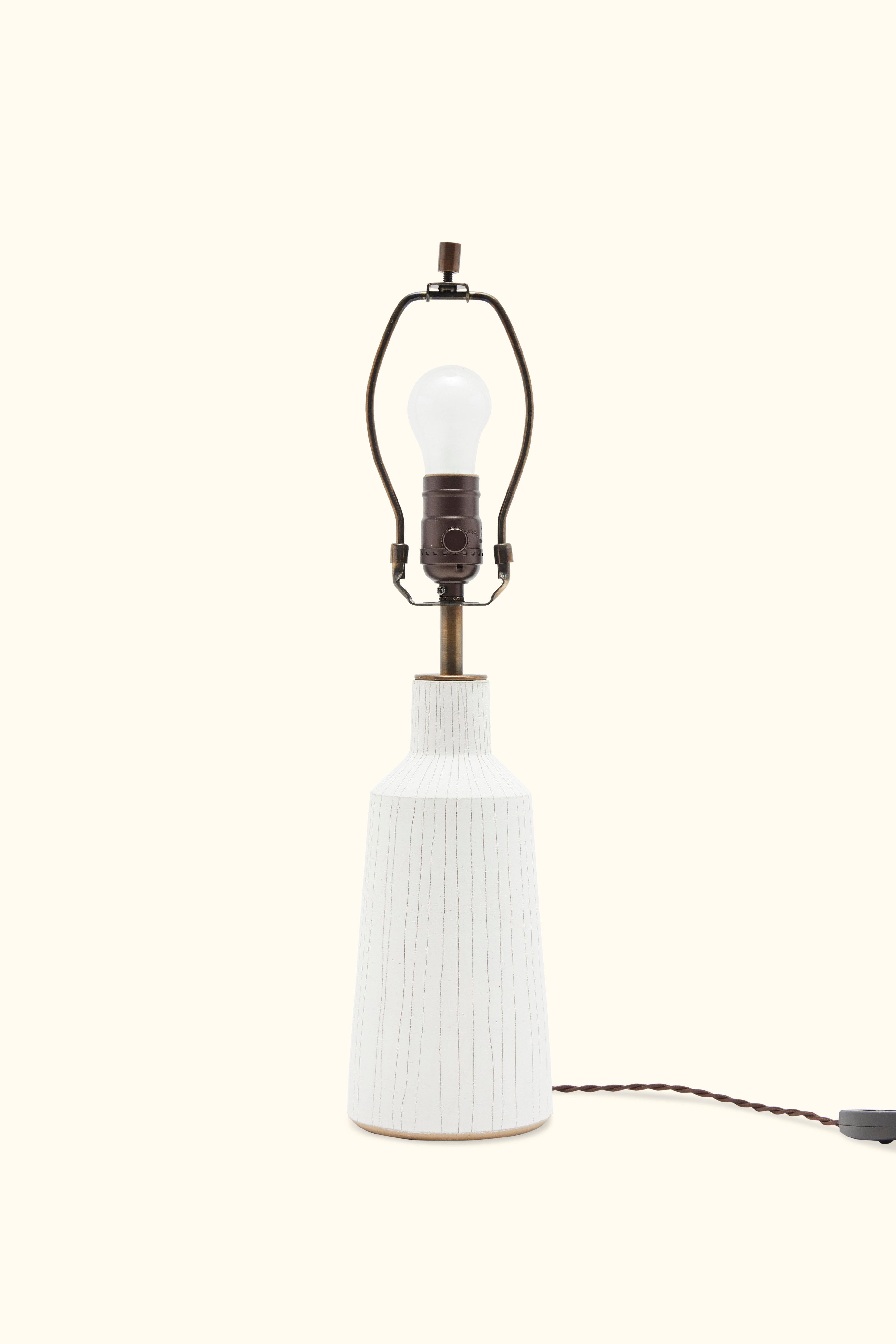 White striped Delos Lamp by ceramic artist Victoria Morris.