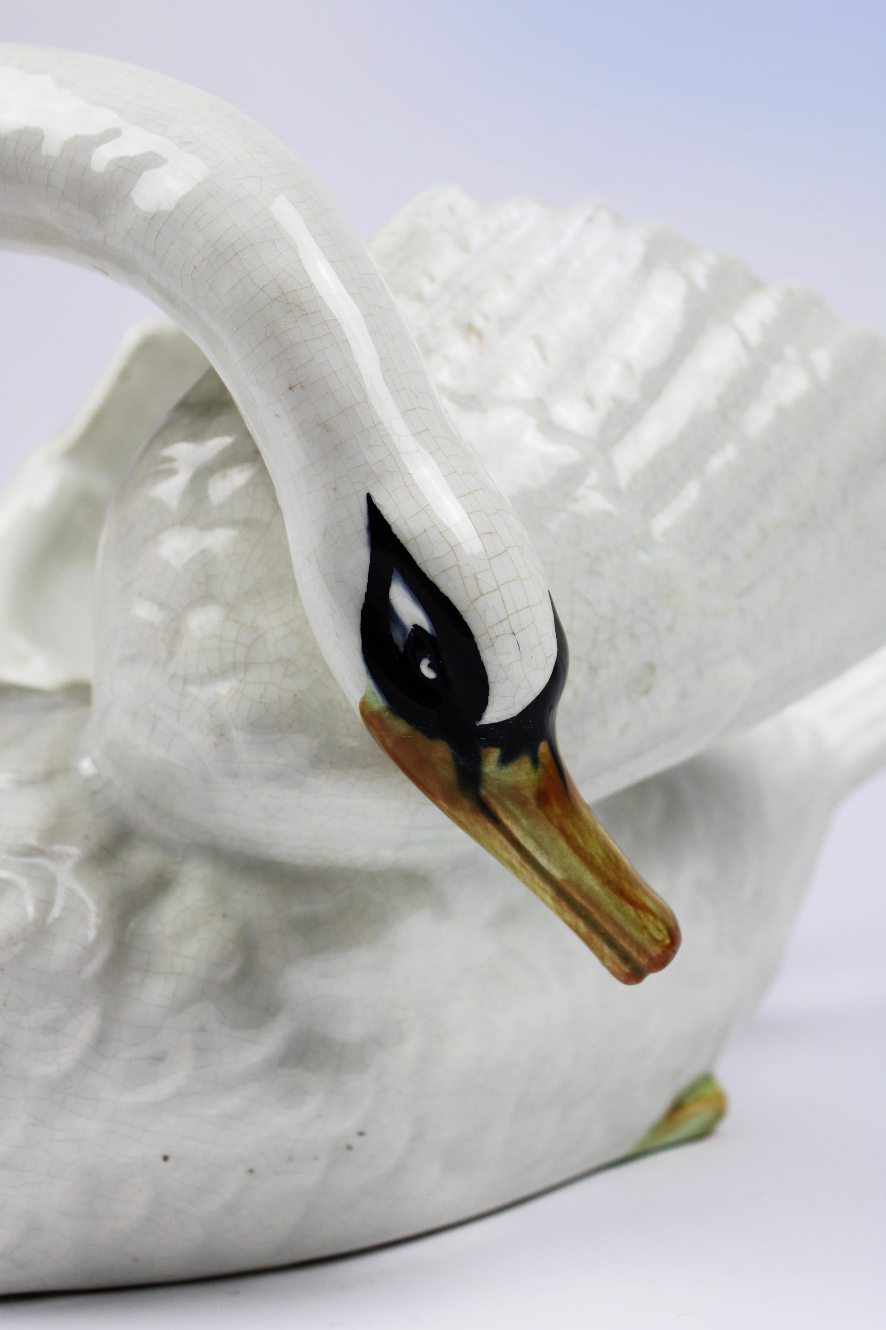 Step into the enchanting world of Art Nouveau with this exquisite Off-White Swan Jardinière from Belgium, crafted in 1900 and stamped with the mark of Imeriale Nimy. This majestic piece of majolica pottery embodies the quintessential elegance of the