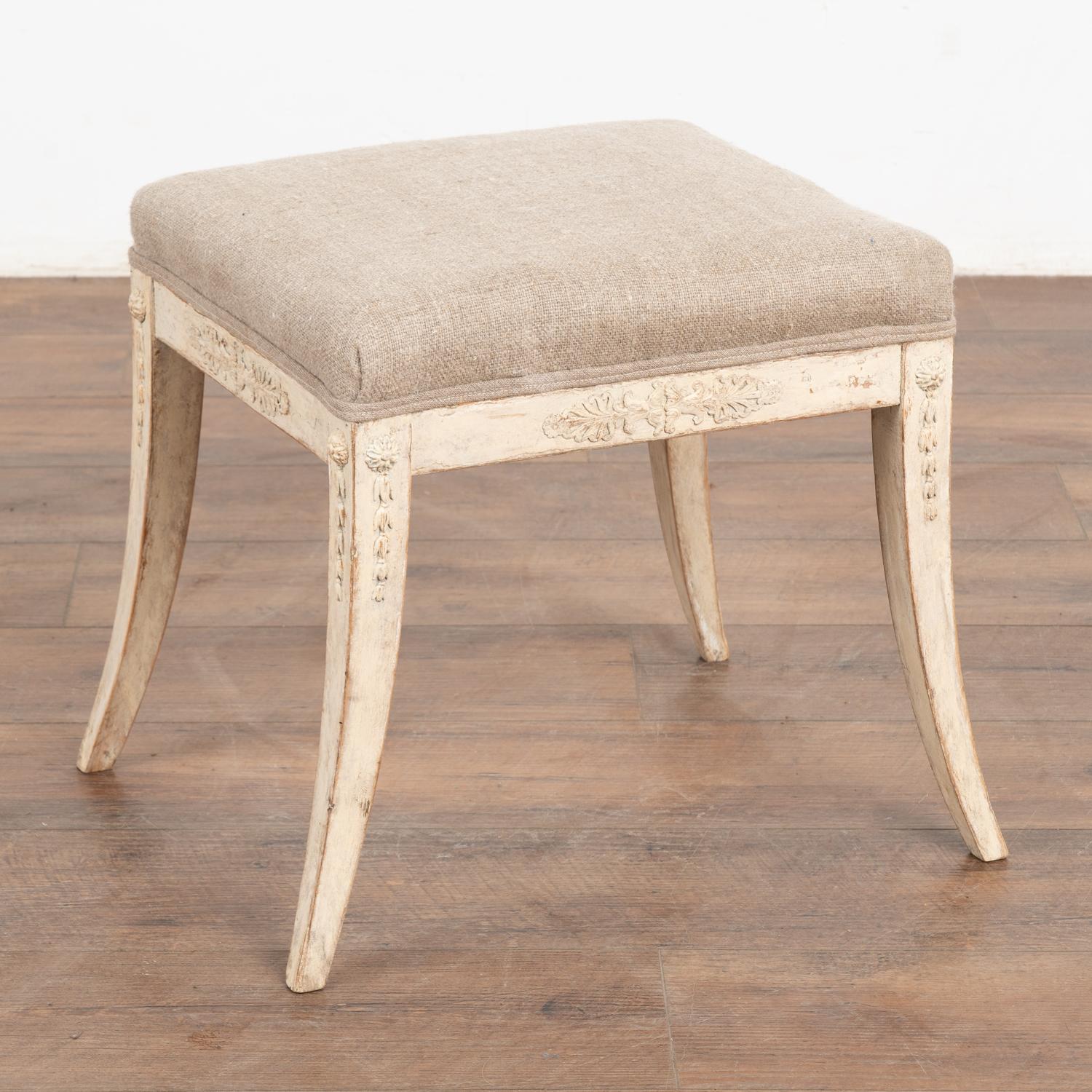 This Swedish stool or tabouret has graceful saber legs and applied carving along the skirt and legs which adds an elegant touch.
Restored, solid/stable and ready to be enjoyed. Later professionally painted in layered shades of antique white, all