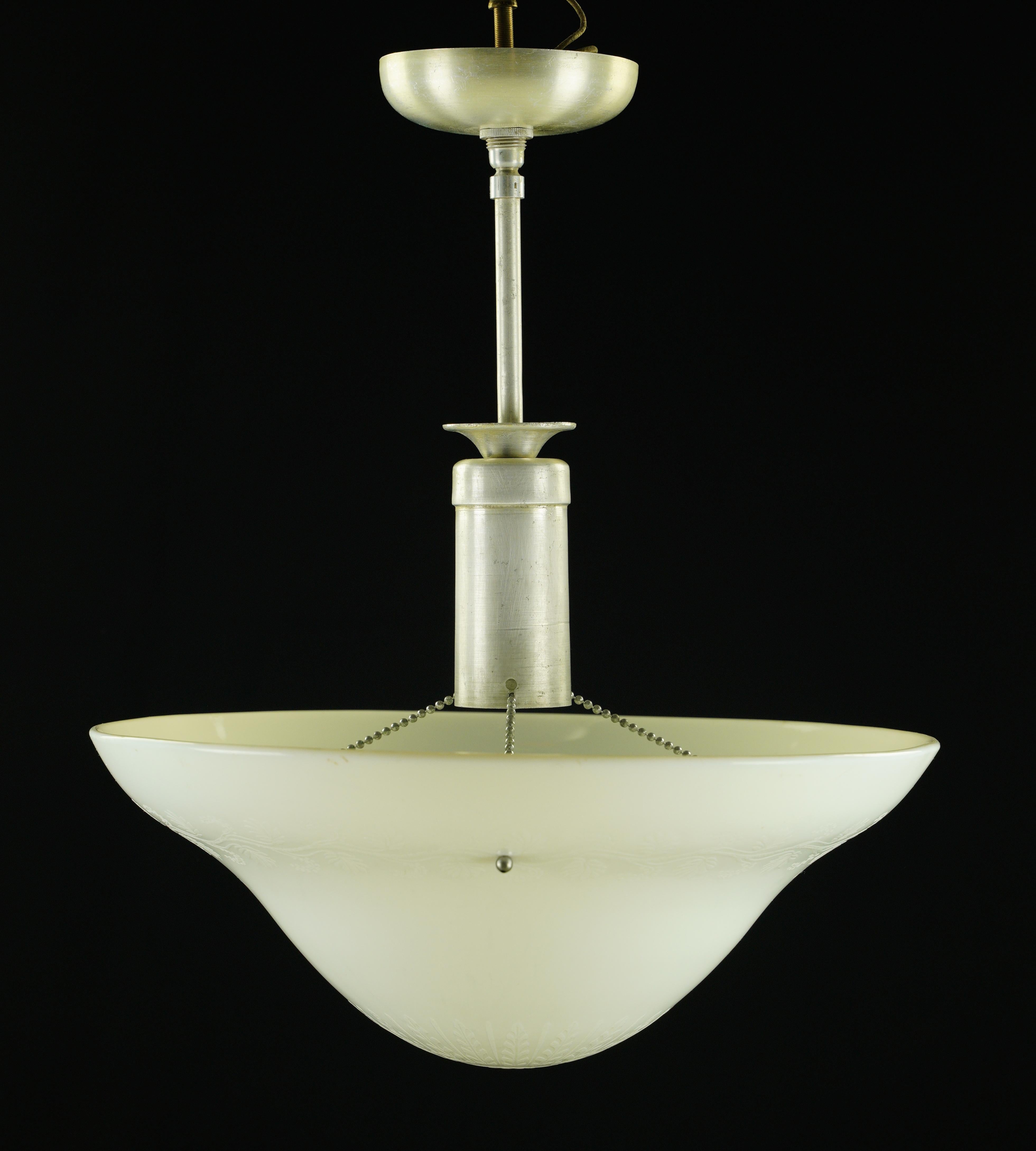 Modern white textured glass saucer shade pendant light paired with a brushed steel pole fitter. The price includes restoration of cleaning and rewiring. This requires one standard medium base bulb. Good condition with surface wear from prior use.