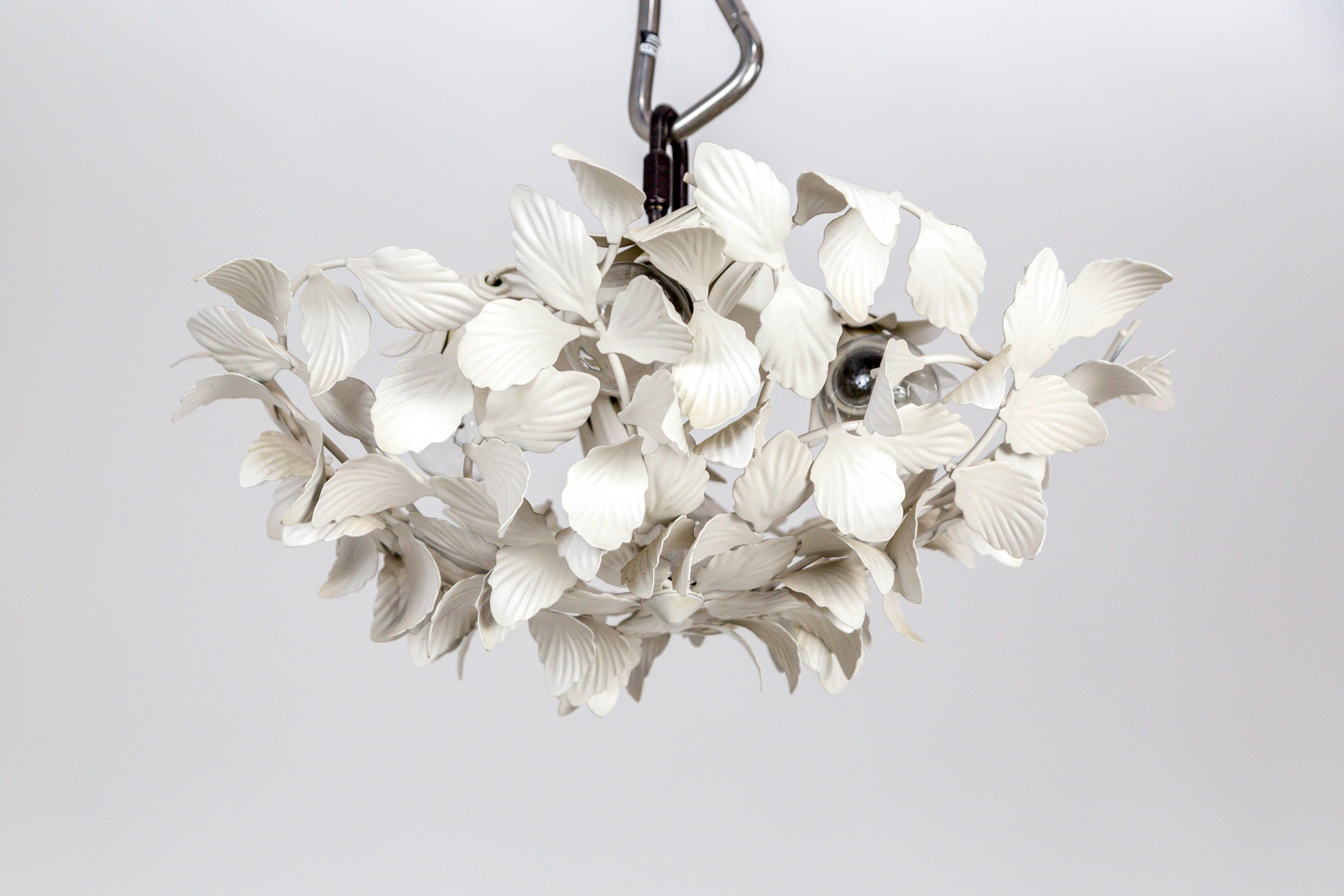 We have 2 vintage, white, painted metal pendant lights in a leaf cluster design. They work beautifully on the ceiling or wall-mounted. The four, medium base sockets are held in decorative, tole leaf socket covers, mounted to the canopy. A short stem