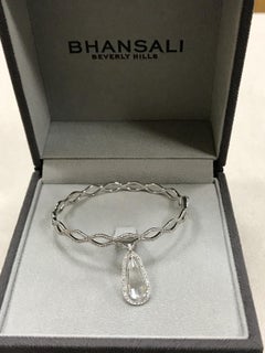 18kt White Gold Bangle with Diamonds and White Topaz
