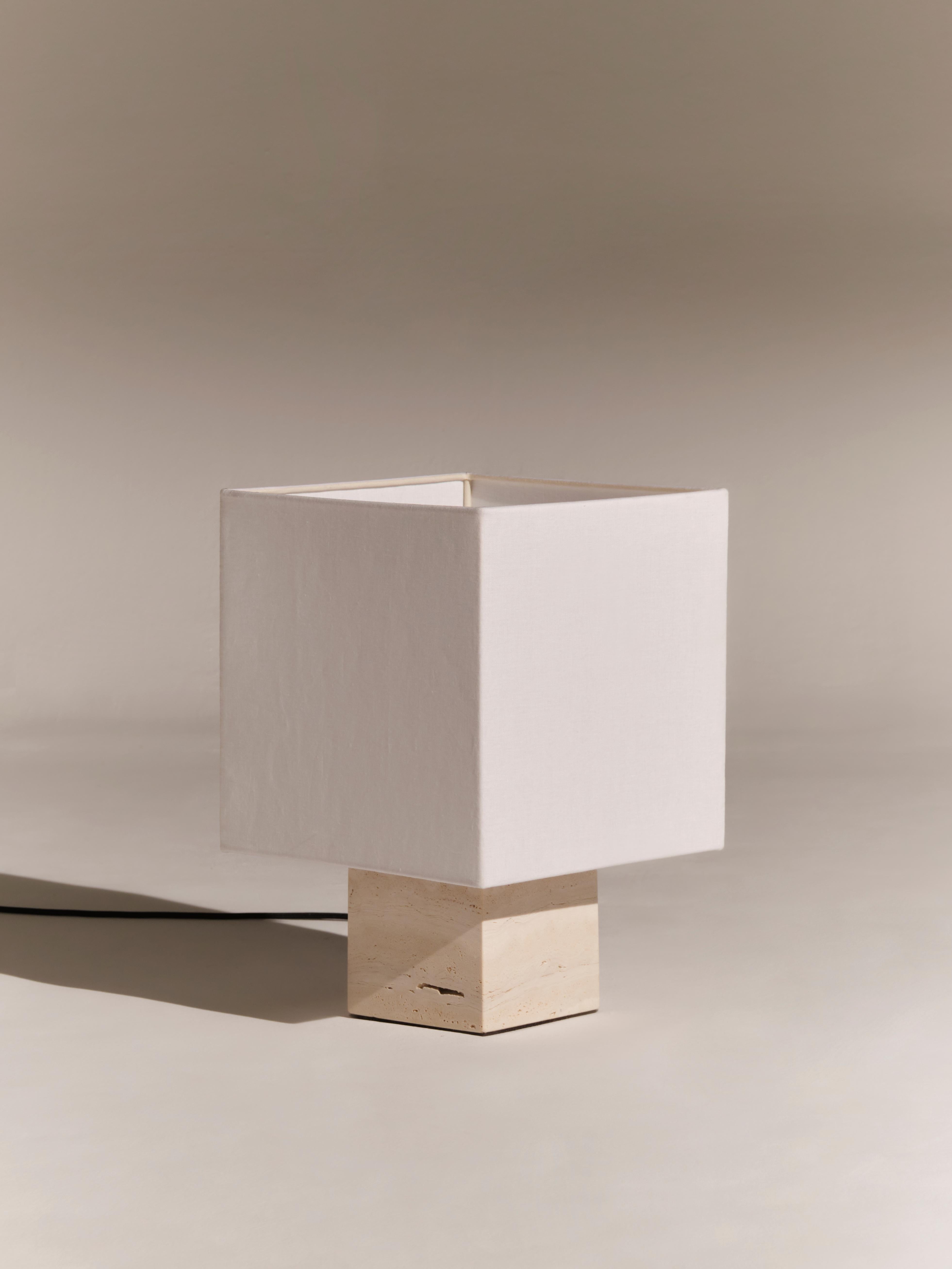 White Travertine Small Roma 1 Square Table Lamp by NASSI
Dimensions: W 30 x D 30 x H 44 cm. 
Materials: Fine cotton lining, pure linen fabric in white. 
Base: White Travertine, nickel plated brass. 
Weight: 9 kg

Also available in 4 colors (white,