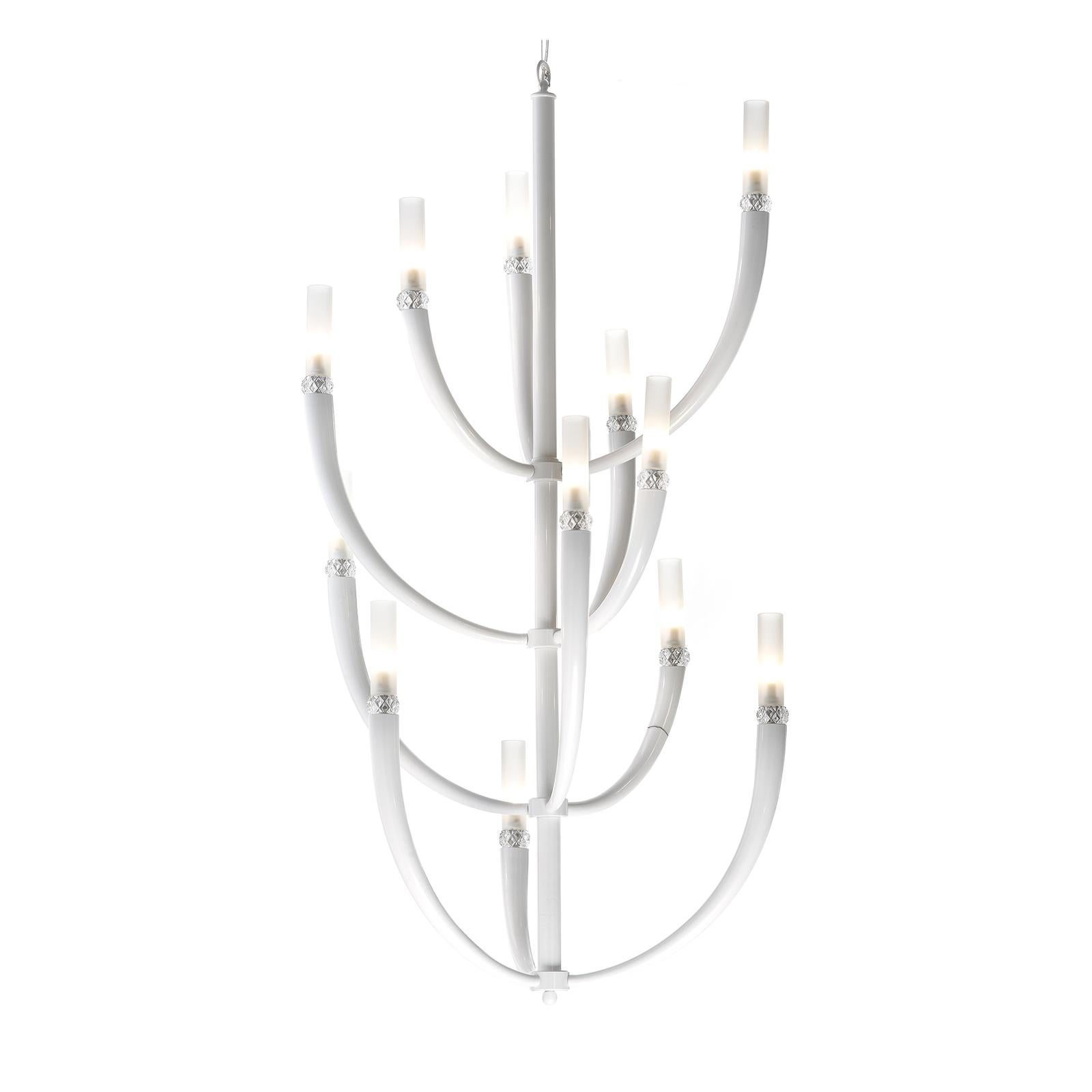 The design of this unique chandelier is inspired by nature and features a series of branch-like elements stemming upward from a central vertical piece that hangs from the ceiling. This stylized interpretation of a tree is both light and dynamic and