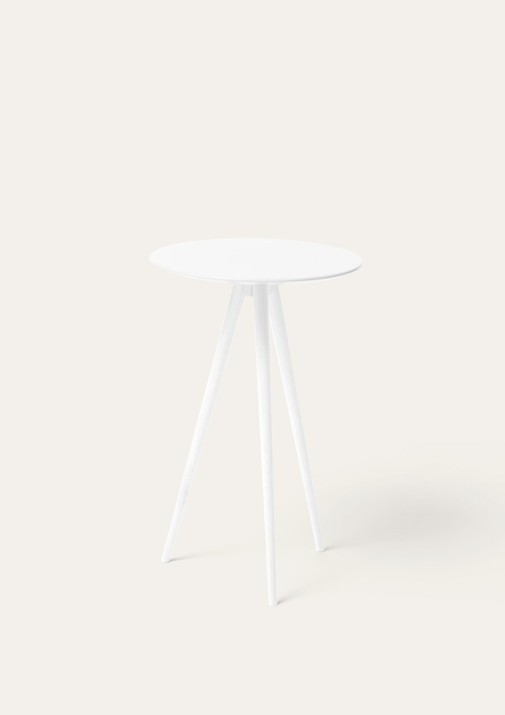 White Trip side table by Storängen Design
Dimensions: D 35 x H 62 cm
Materials: birch wood.
Also available in other colors.

Trip is our smallest table, a lightweight three-legged surface entirely made of birch. A decorative item that can be