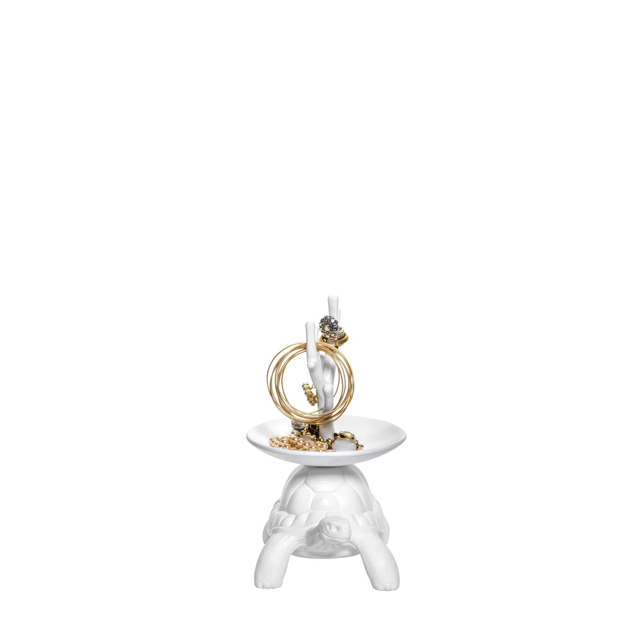 After the success of Turtle Carry, Marcantonio presents the iconic turtles in a small version.
The turtle carapace supports a jewelry tree.

Produced in white opaque resin, they catch the attention and they fit perfectly into any corner of the