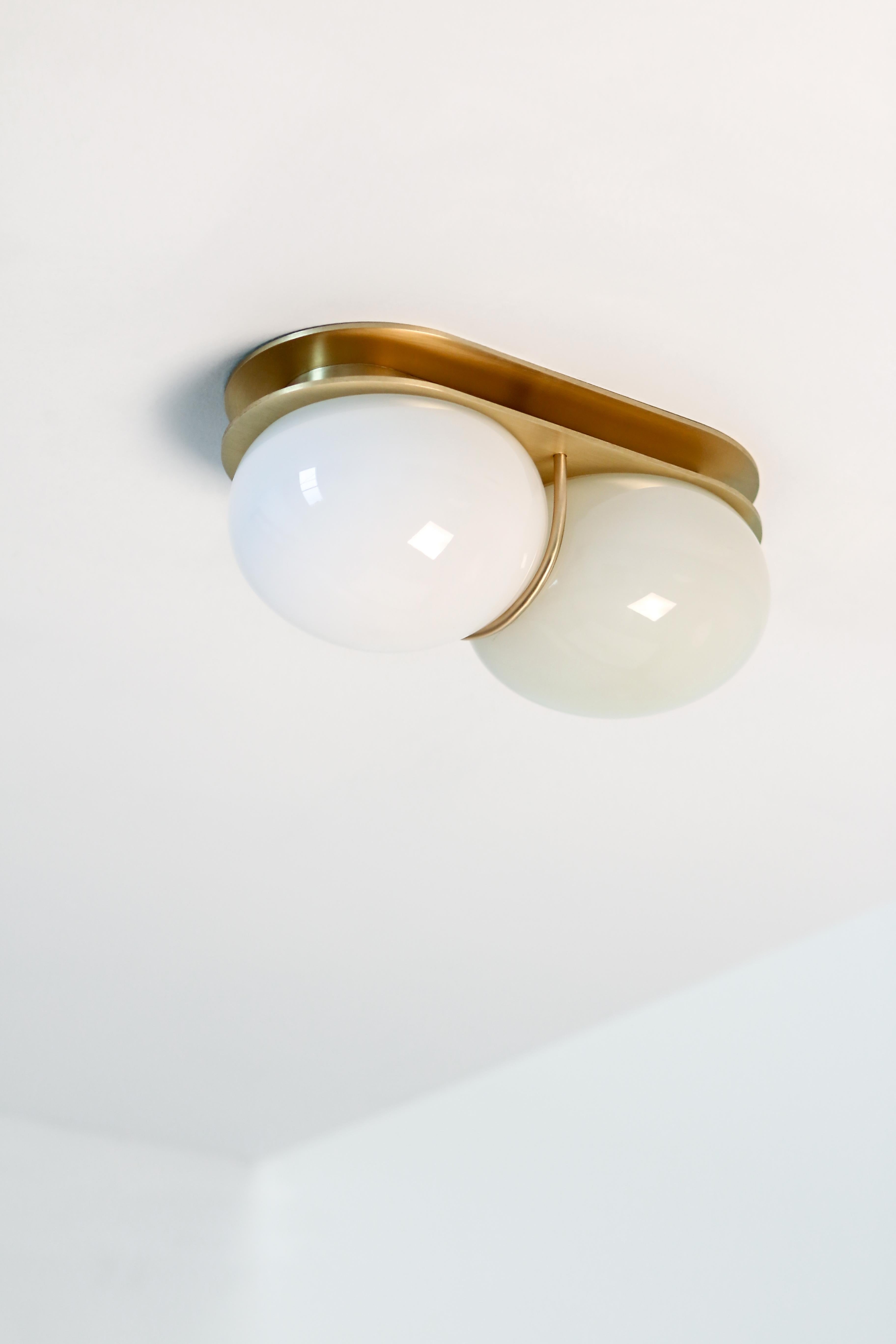 White twin 2.0 sconce by SkLO
Dimensions: D 12.7 x W 15 x H 28 cm
Materials: glass, brass
Available in blue, mint green, oyster, pastel pink and white palette.
Available in 4 metal finishes: dark oxidized, brushed brass, polished nickel, brushed