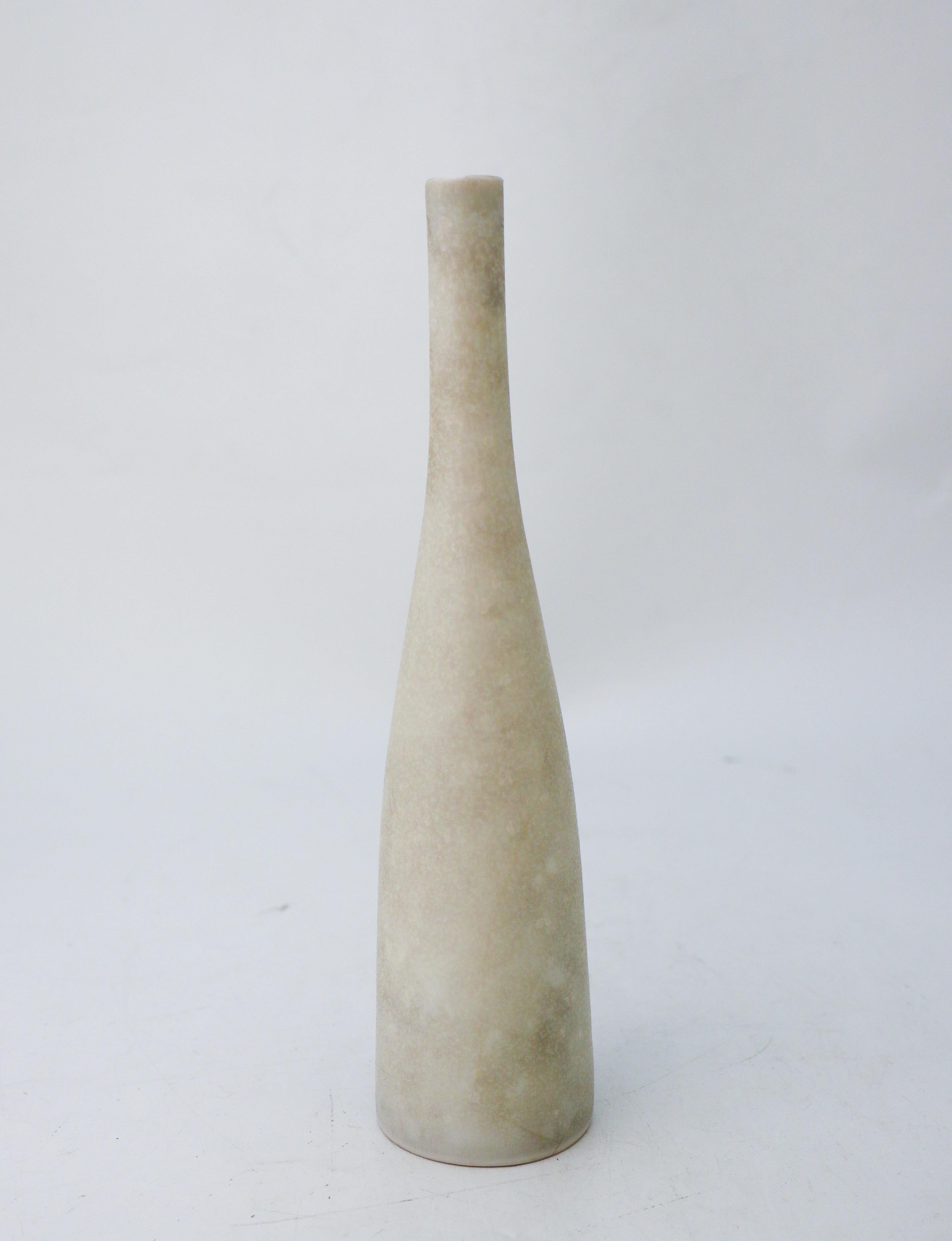 A white, unique vase designed by Carl-Harry Stålhane at Rörstrand. The vase is 22,5 cm (9