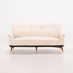 White upholstered Italian three leg sofa circa 1950, having new fabric.