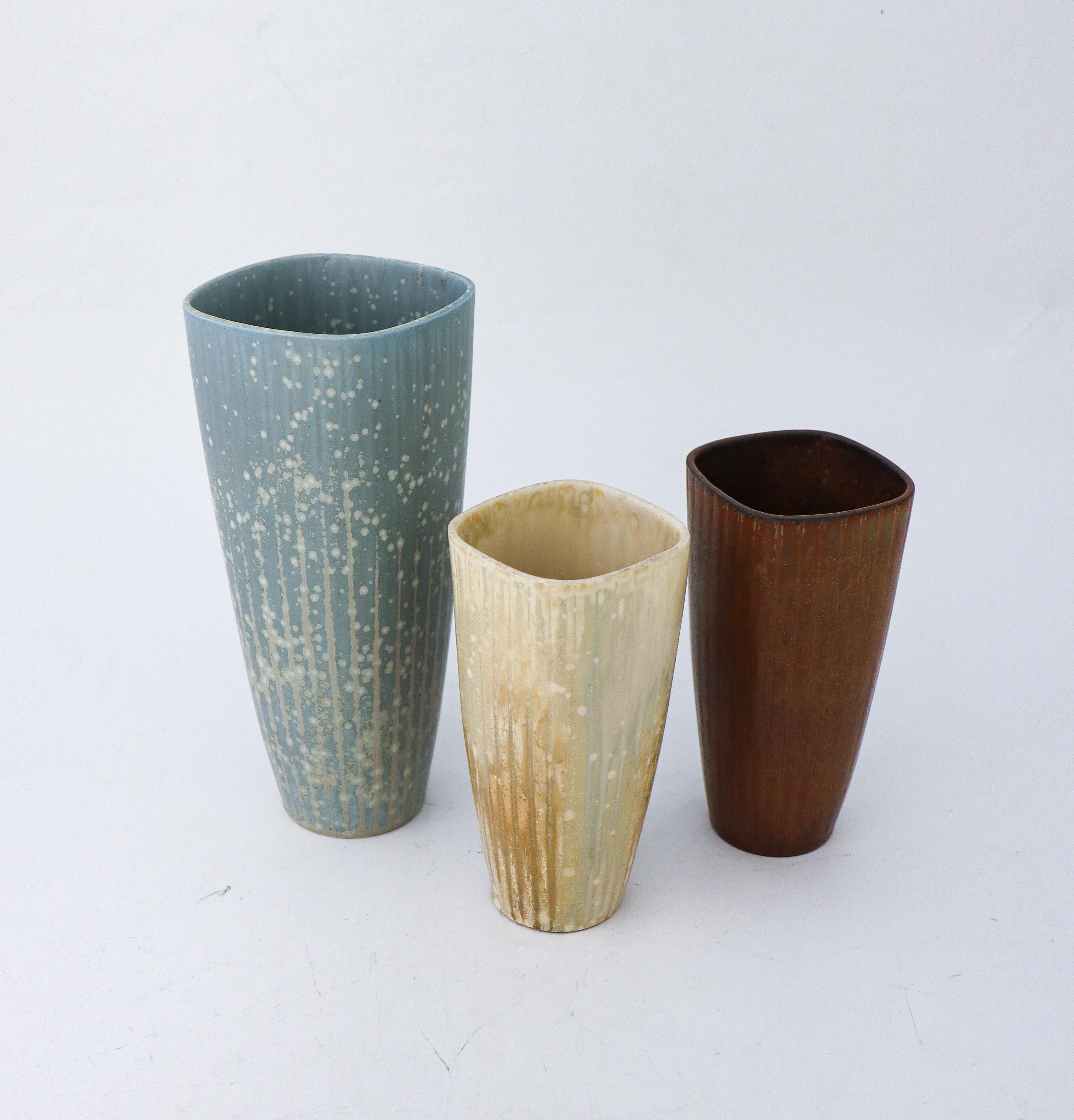A group of three vases with a lovely glaze designed by Gunnar Nylund at Rörstrand, the vase are 21.5 cm (5