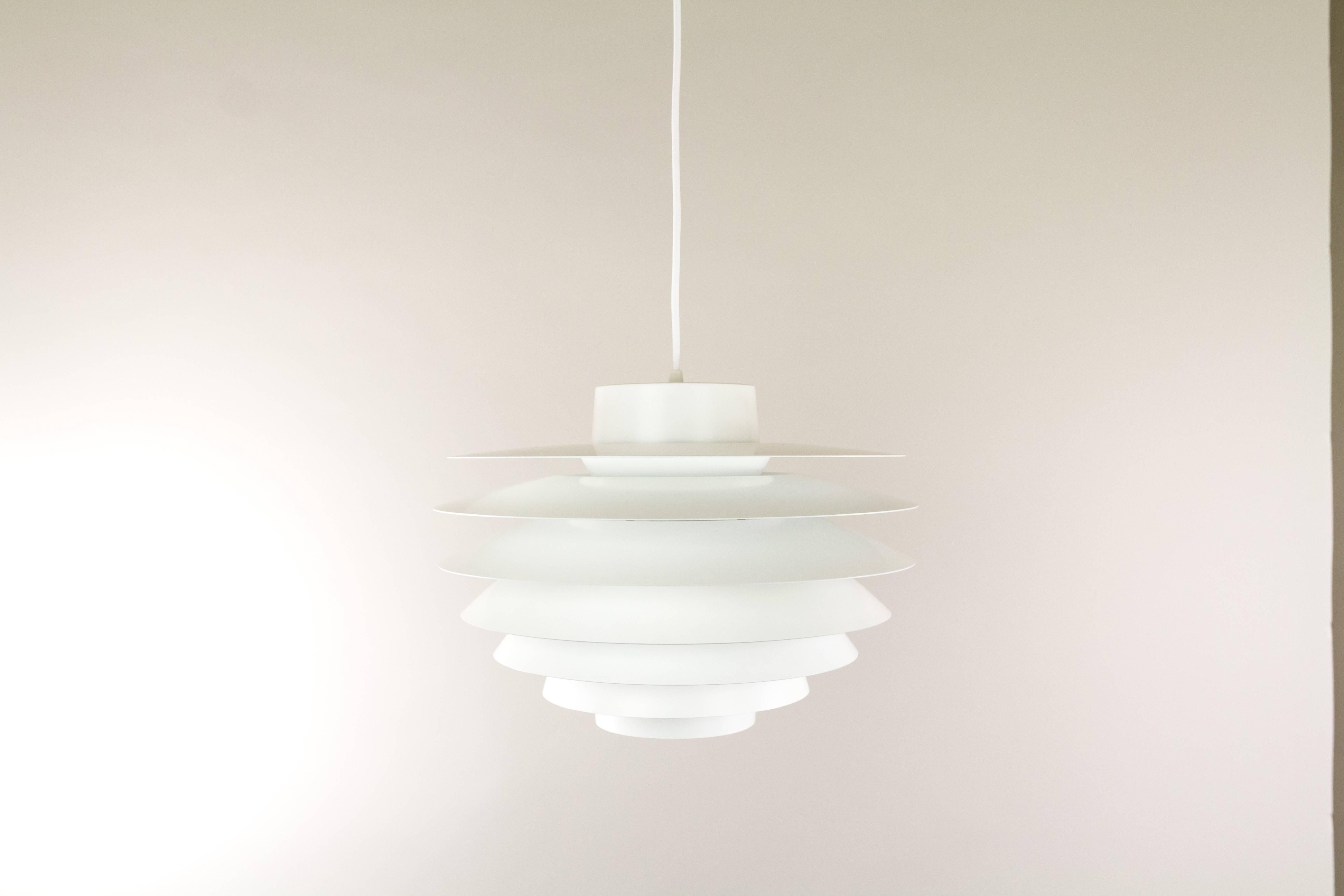 This pendant, model Verona was designed by Svend Middelboe in the 1970s and manufactured by the Danish lighting company Nordisk Solar. It is made from white lacquered metal and consists of seven shades.

A page from a Dutch lighting catalogue from