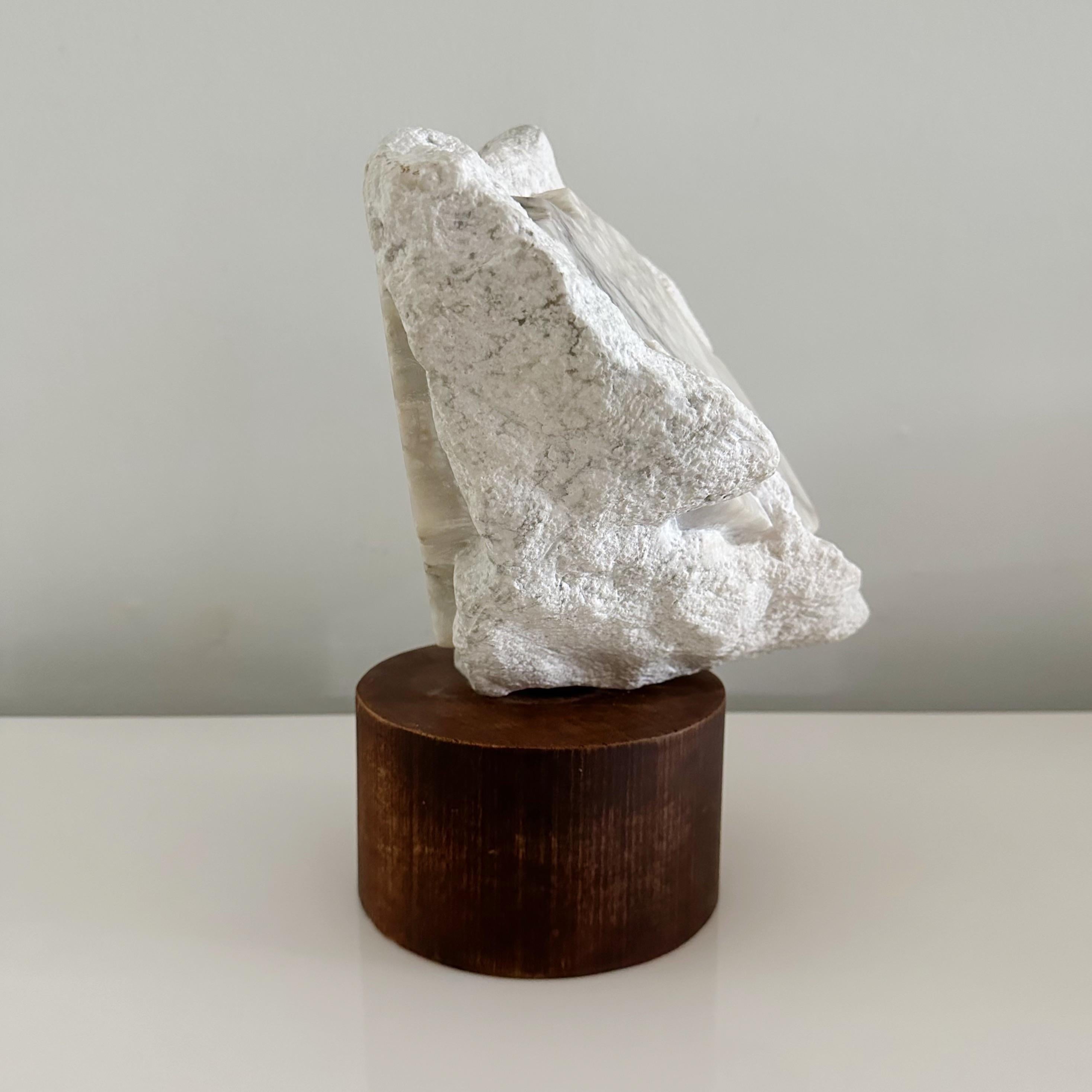 Vintage white marble organic freeform sculpture resting on wood base. Wood base is 6.5