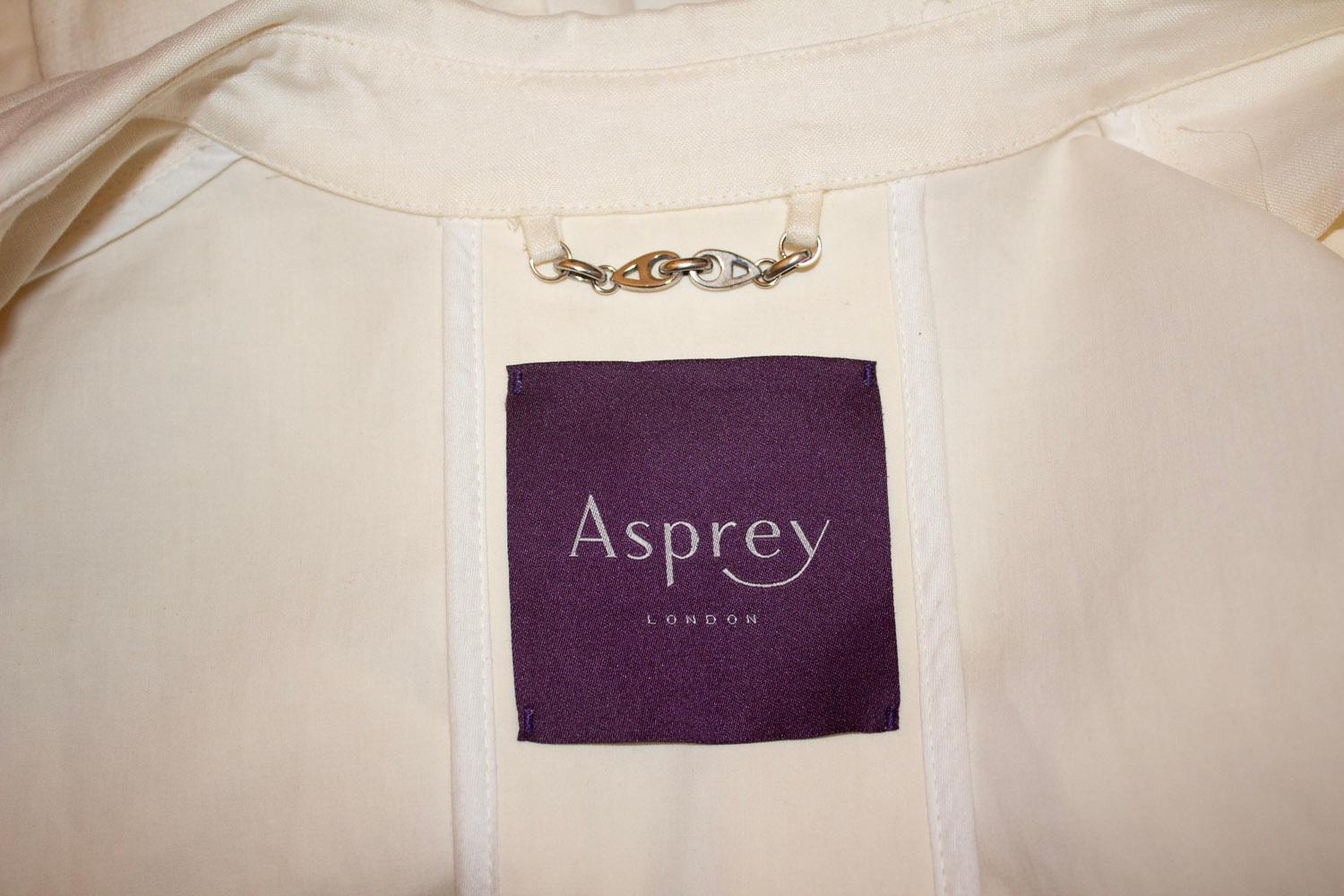 A great coat for Summer by British Heritage brand Asprey. The coat is in a linen mix and has a button front, two pockets plus a vent at the back. UK size 10. Measurements: Bust up to 39'', length 30''