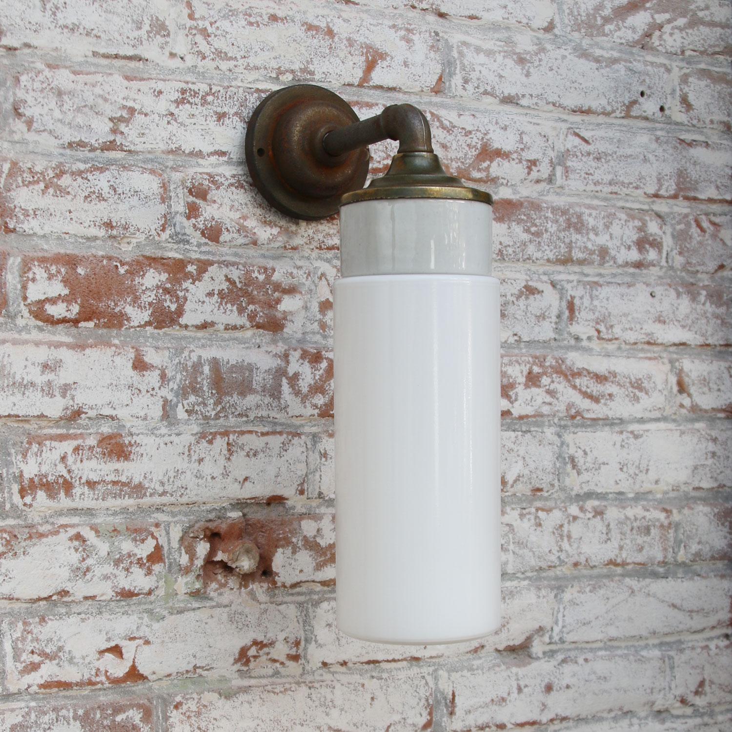 Porcelain Industrial wall lamp.
White porcelain, brass and cast iron
Opaline milk glass.
2 conductors, no ground.

Diameter cast iron wall piece 10 cm. 2 holes to secure.

Weight: 2.10 kg / 4.6 lb

Priced per individual item. All lamps have been