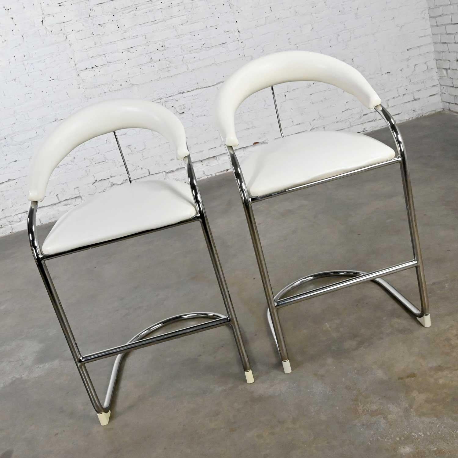 Fabulous vintage white vinyl & chrome tube pair of barstools by Thonet in the style of the Model SS33 Bauhaus cantilever chair by Anton Lorenz. Beautiful condition, keeping in mind that these are vintage and not new so will have signs of use and
