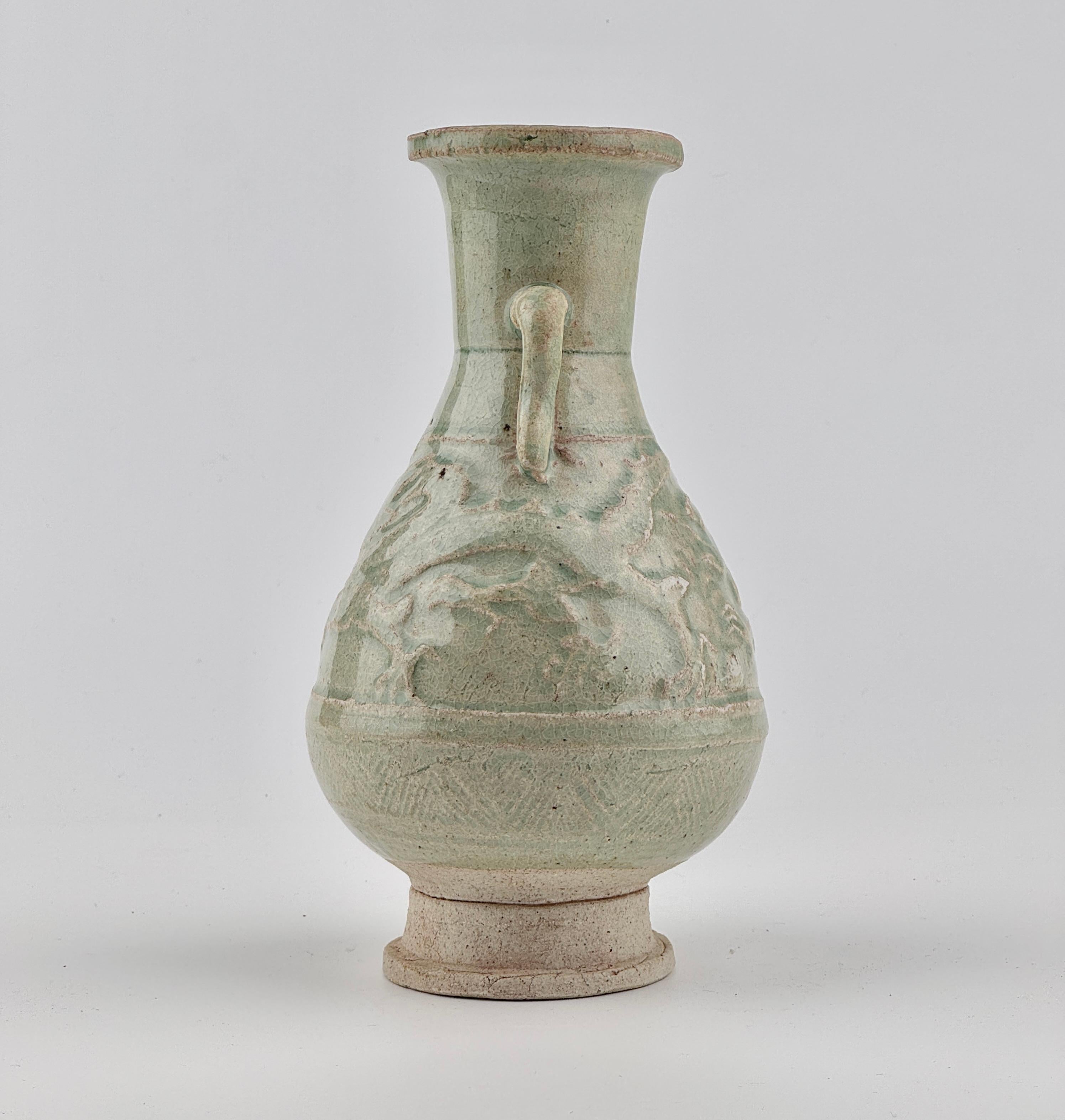 This vase is made from a type of low-fired, porous clay and features a crackled glaze. It bears resemblance to the renowned funerary vases and covers adorned with applied decorations.

Period : Yuan Dynasty(1271-1368)
Type : vase
Medium : Qingbai