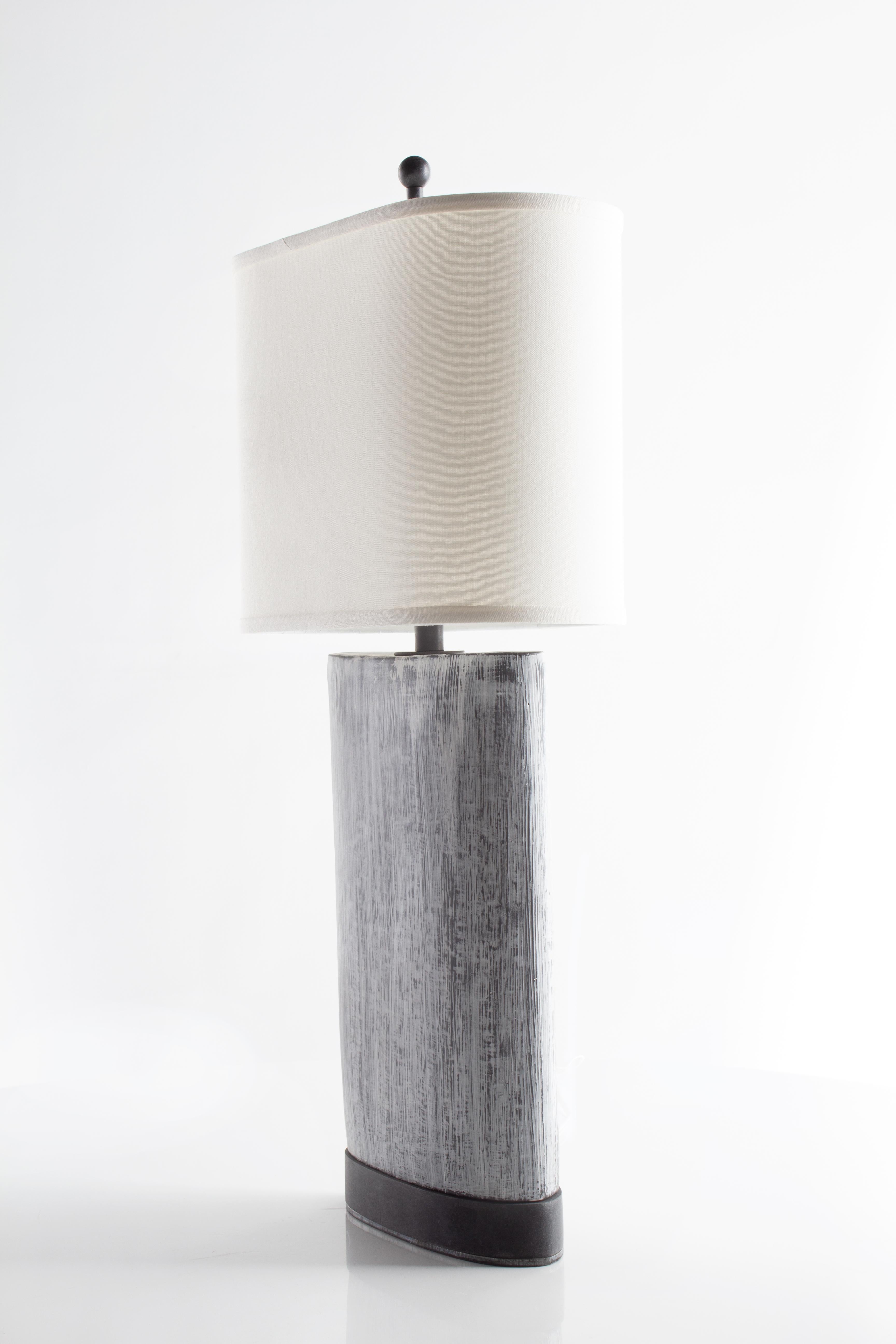 Ceramic. 

Off-white linen shade.

Hand-crafted in Italy. Sold exclusively by Brendan Bass.
