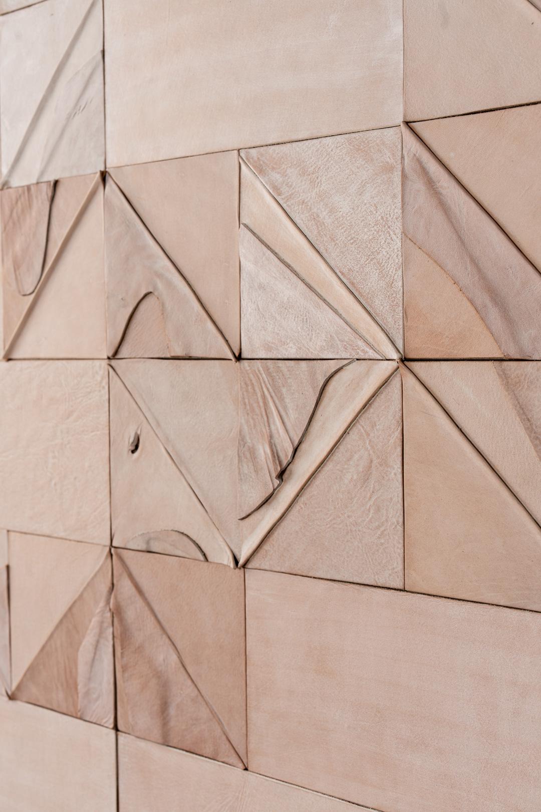 These WHITE WASH LEATHER collage tiles are made in modular sizes and SOLD BY THE SQUARE FOOT, NOT PER TILE. The tiles can be hung on any wall surface and in any configuration. Each panel is composed randomly and therefore, no two panels are alike.