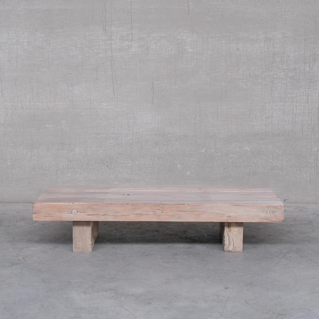 A brutalist sleeper style coffee table. 

Belgium, c1970s.
 
White washed at some point. 

Good condition. 

Heavy and good quality chunky wood. A twist on the darker versions. 

Location: Belgium Gallery.

Dimensions: 62 D x 150 W x 33