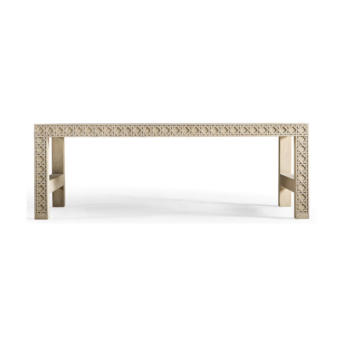 White Washed Oak coffee table, featuring a digitally carved, traditional woven cane design, the table boasts mesmerizing textural layers. White-washed oak with stunning grain detail is paired flawlessly with a solid hardwood top for a sophisticated